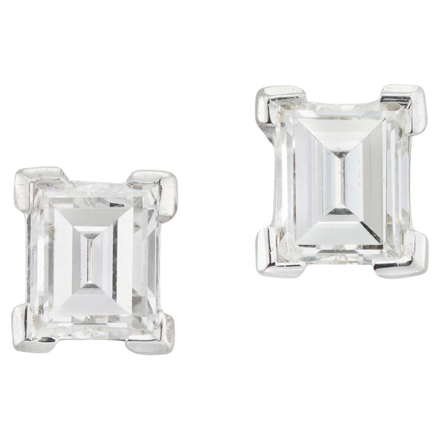 A pair of diamond stud earrings