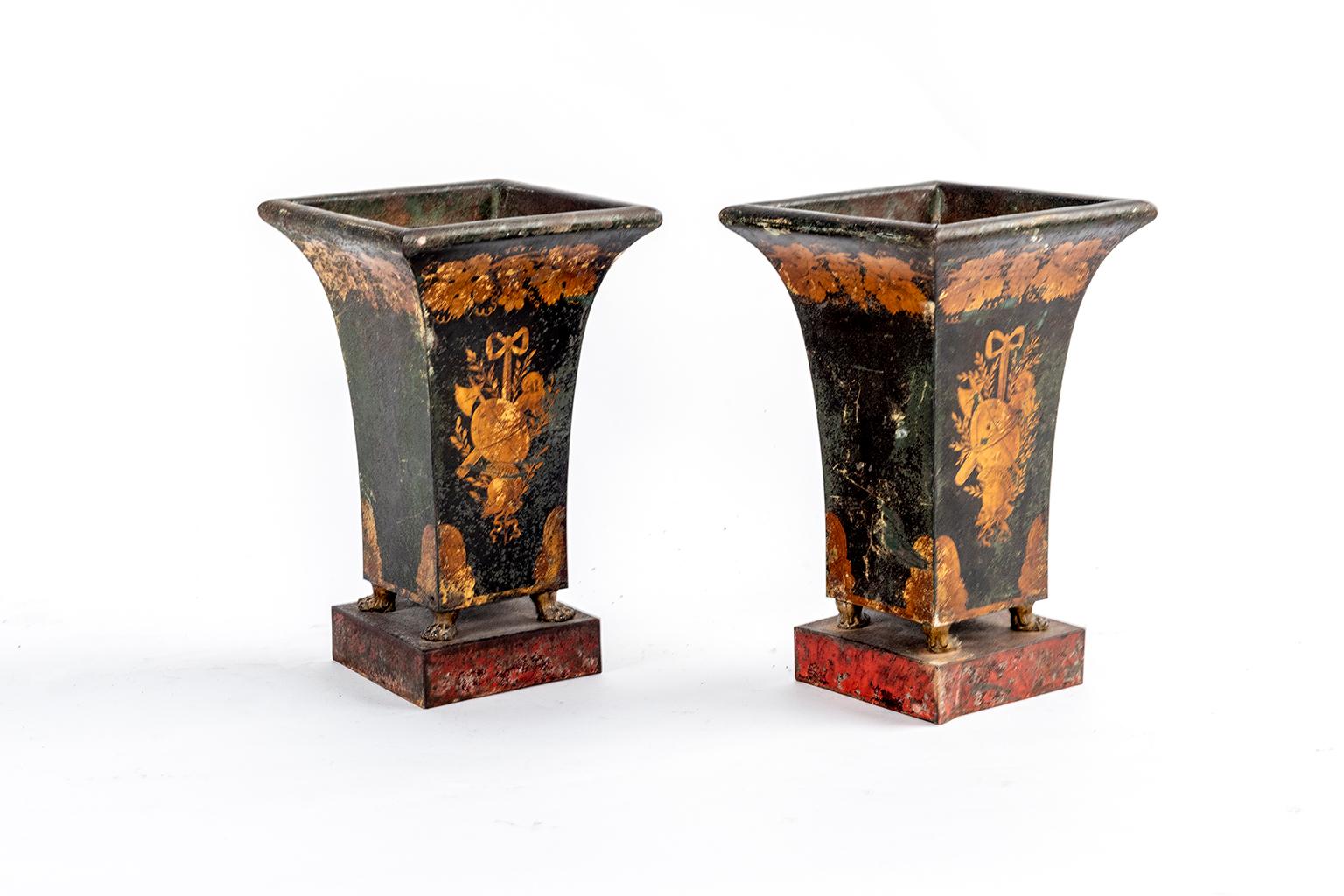 A pair of Directoire tole vases in gilt and black.