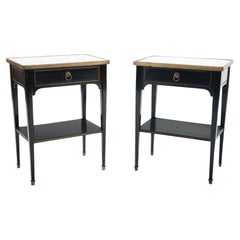 A pair of Directoire style ebonized night stands with marble tops, circa 1940.