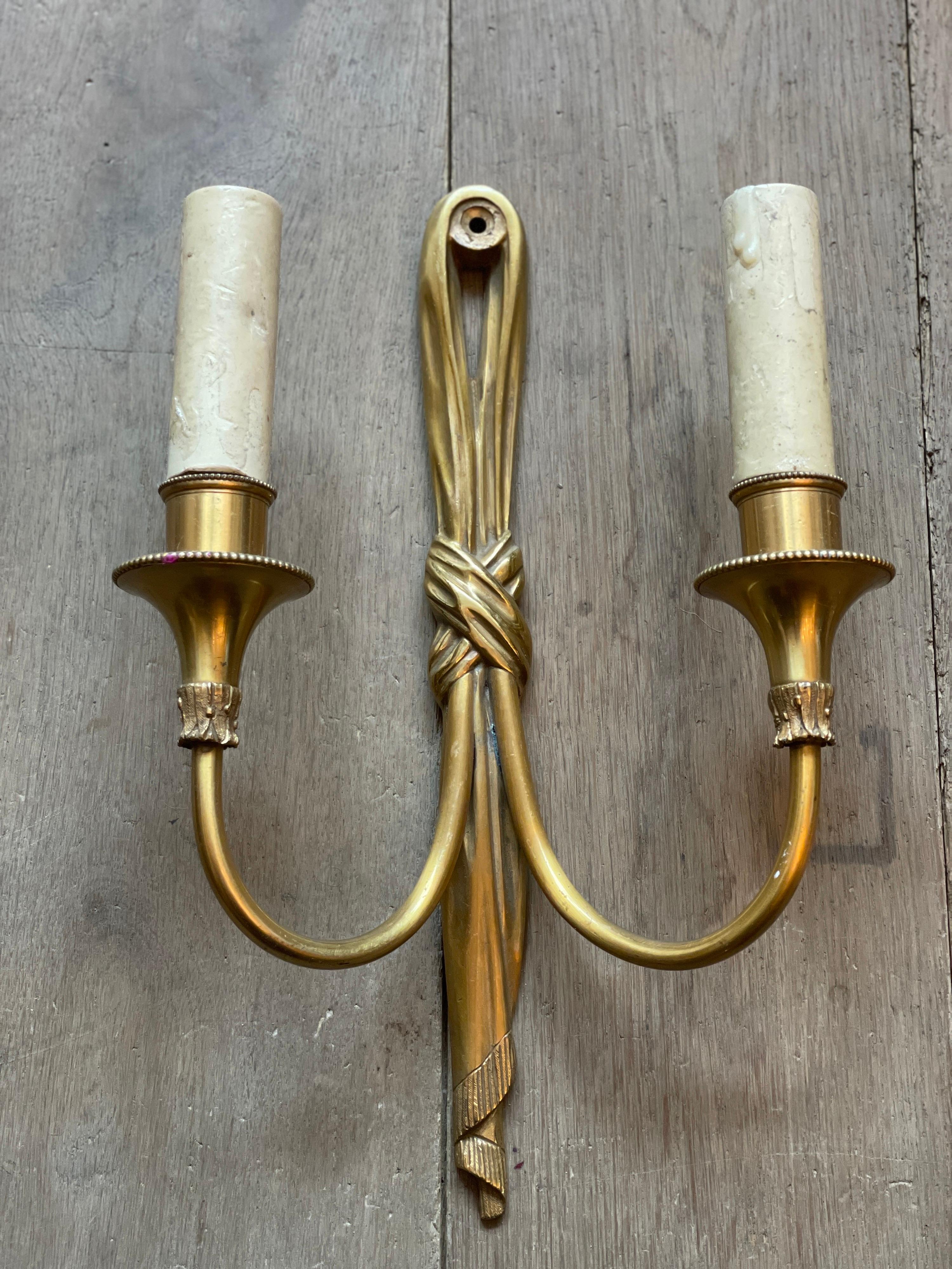A pair of drape wall lights by Maison Charles Paris in gilt bronze. With waxed realistic bulb holders,
Circa mid 20th century.