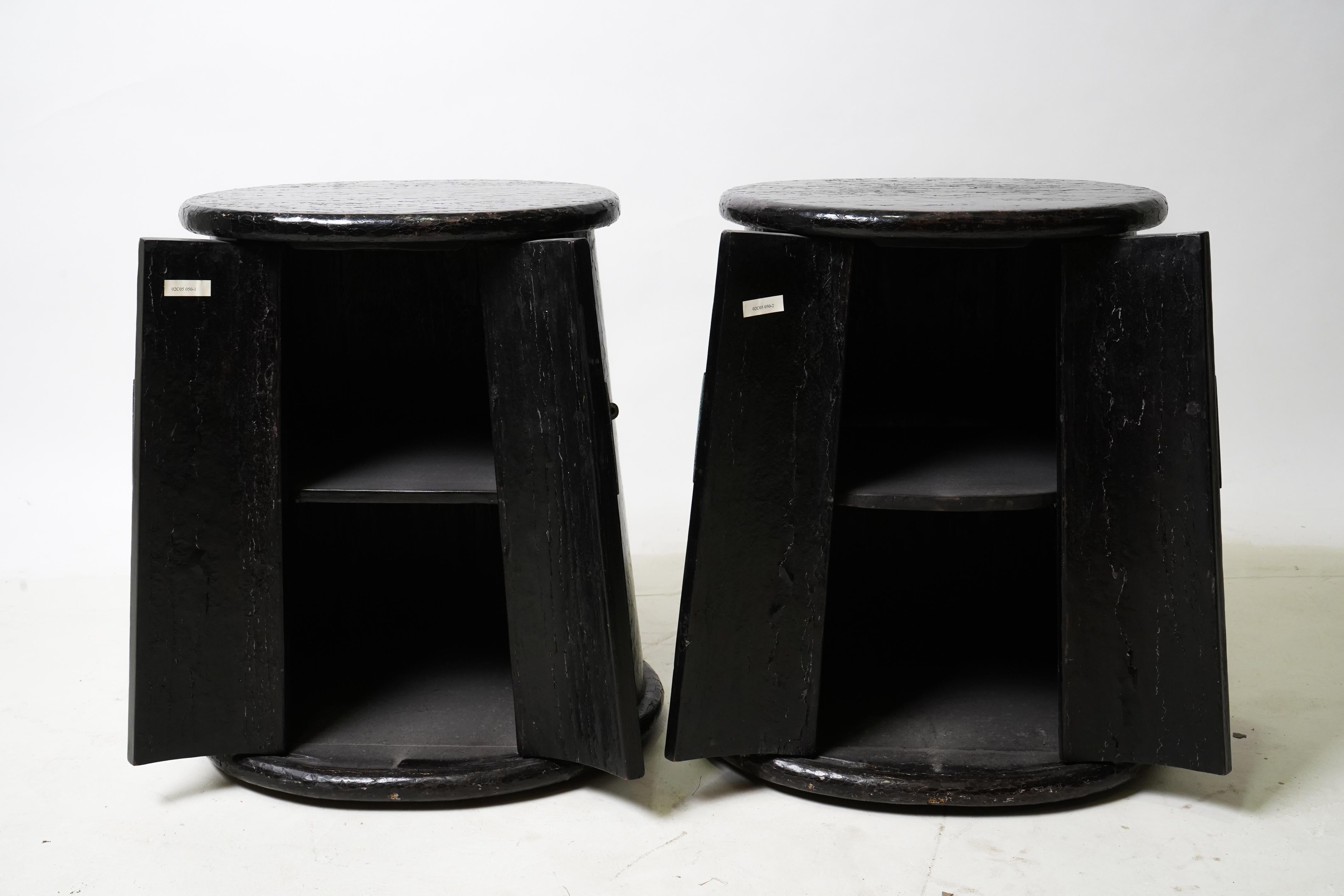 These highly unusual fir wood side chests are found only in Shanxi Province, in the northern part of China, near Beijing. Their tapered shape is highlighted by black lacquer, which has been enhanced by a layer of French polish. The crackled tops are