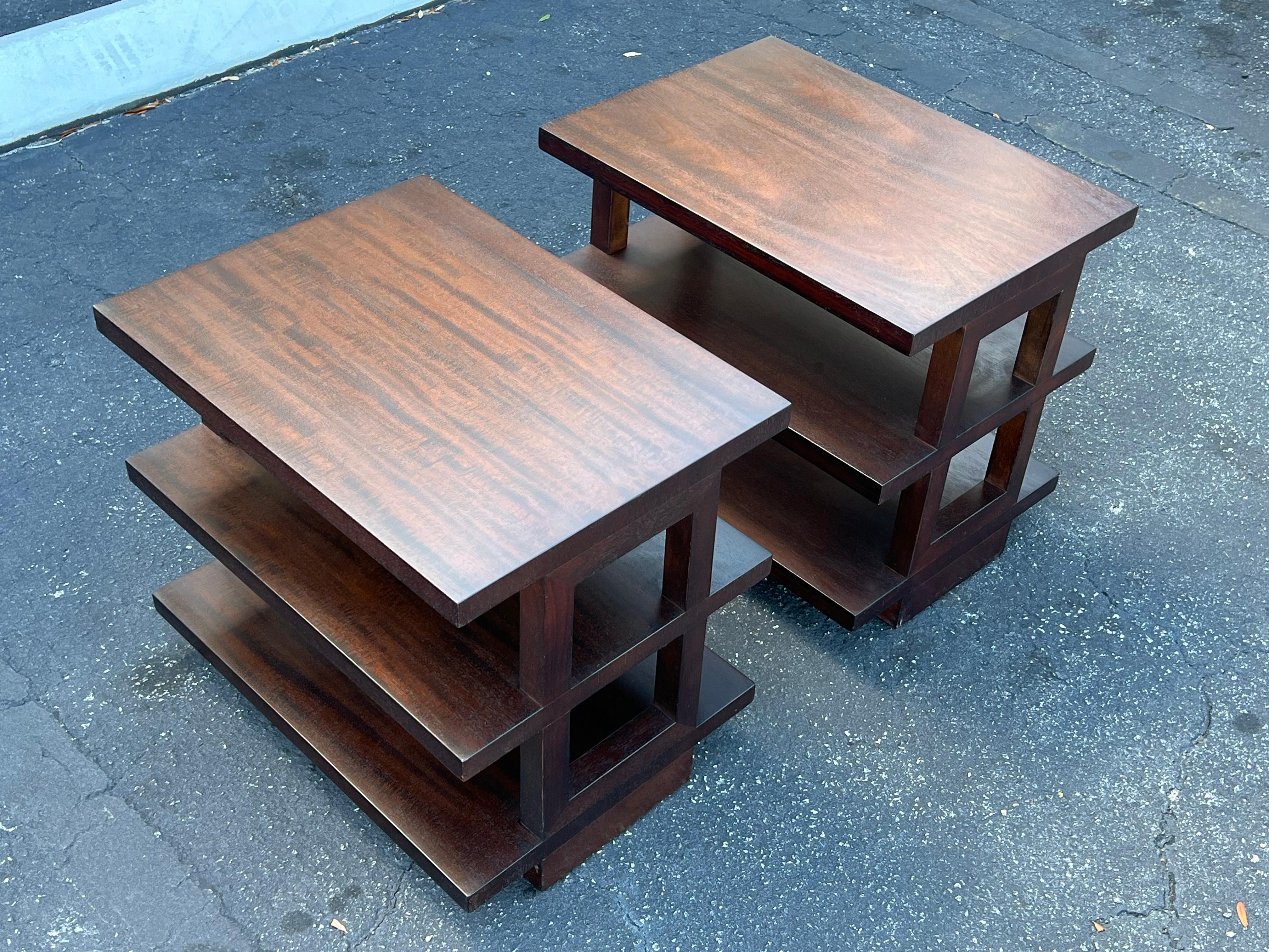 A pair of rare Edward Wormley for Dunbar three tier occasional tables # 4423.  Refinished in dark brown walnut.