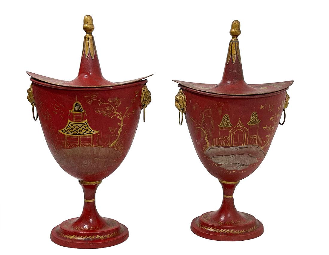 A pair of Dutch chestnut urns with chinoiserie decoration, 19th century.

2 Pieces of 19th Century Dutch red lacquered oval urns with lion's mask and ring handles decorated with gilt chinoiserie scenes on an oval foot. The lids with acorn finials.