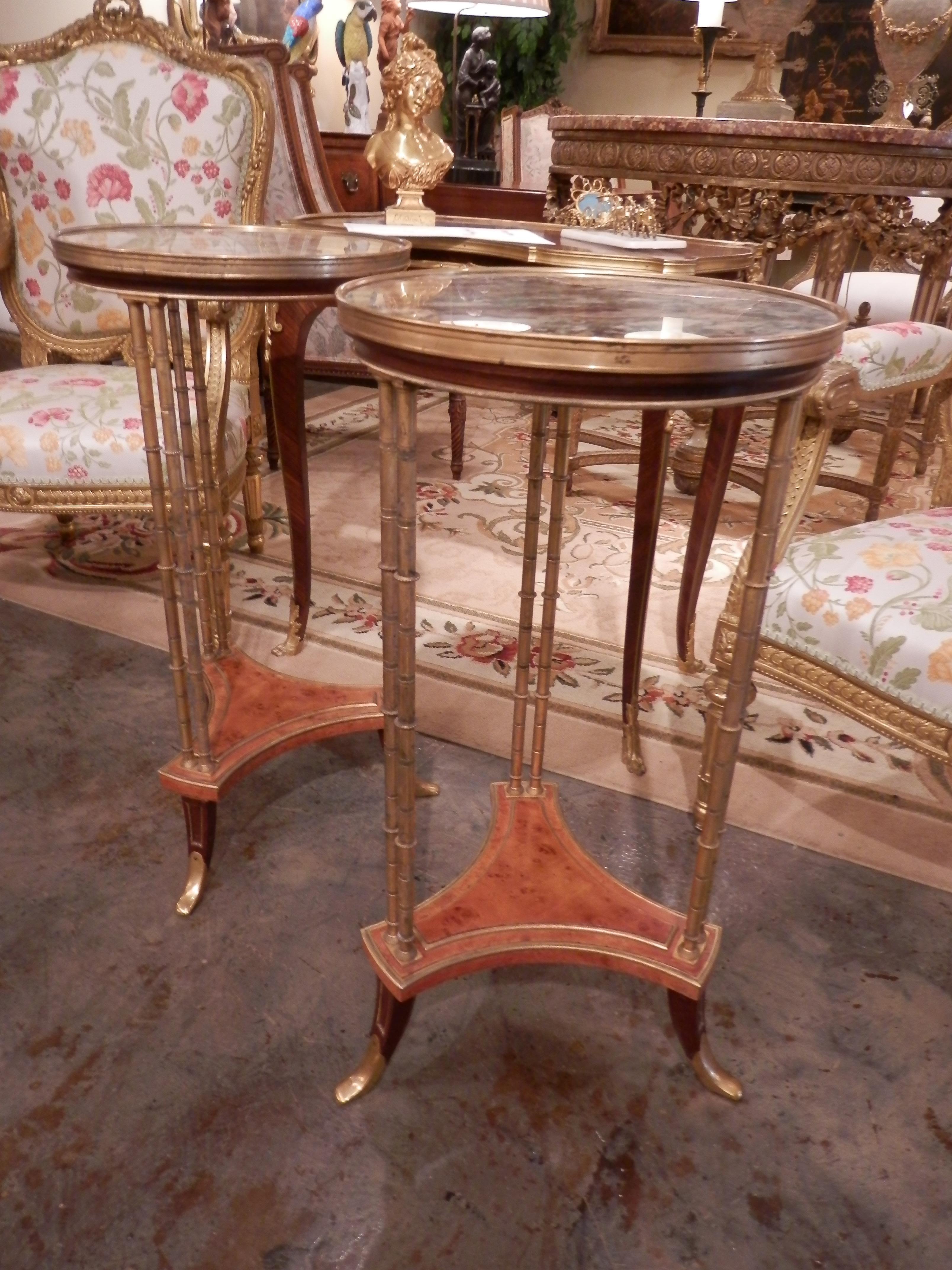 A beautiful pair of early 20th century French Louis XVI marble-top and gilt bronze gueridon tables. Based on a design by Adam Weisweller. These tables are rare to come by and this pair is in excellent condition