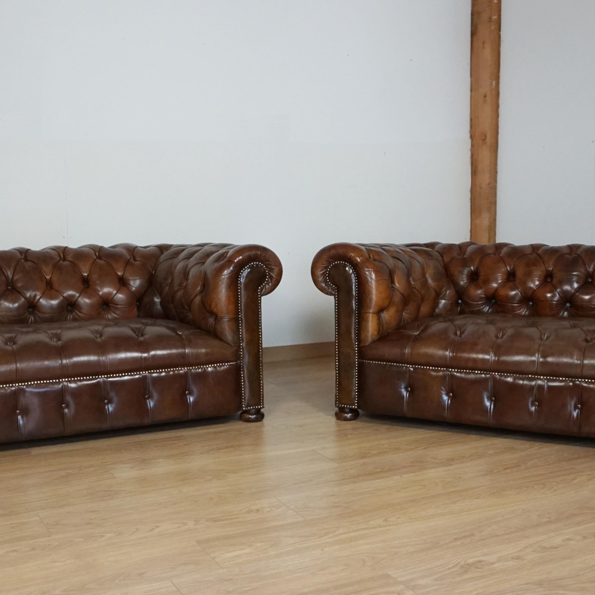 A pair of early 20th century small proportioned chesterfield sofas. Original and restored leather upholstery. Excellent rich brown colour. 

Dimensions: H 69cm W 180cm D 95cm Seat H 36cm W 110cm D 56cm

Origin: English

Date: Circa 1920

Item