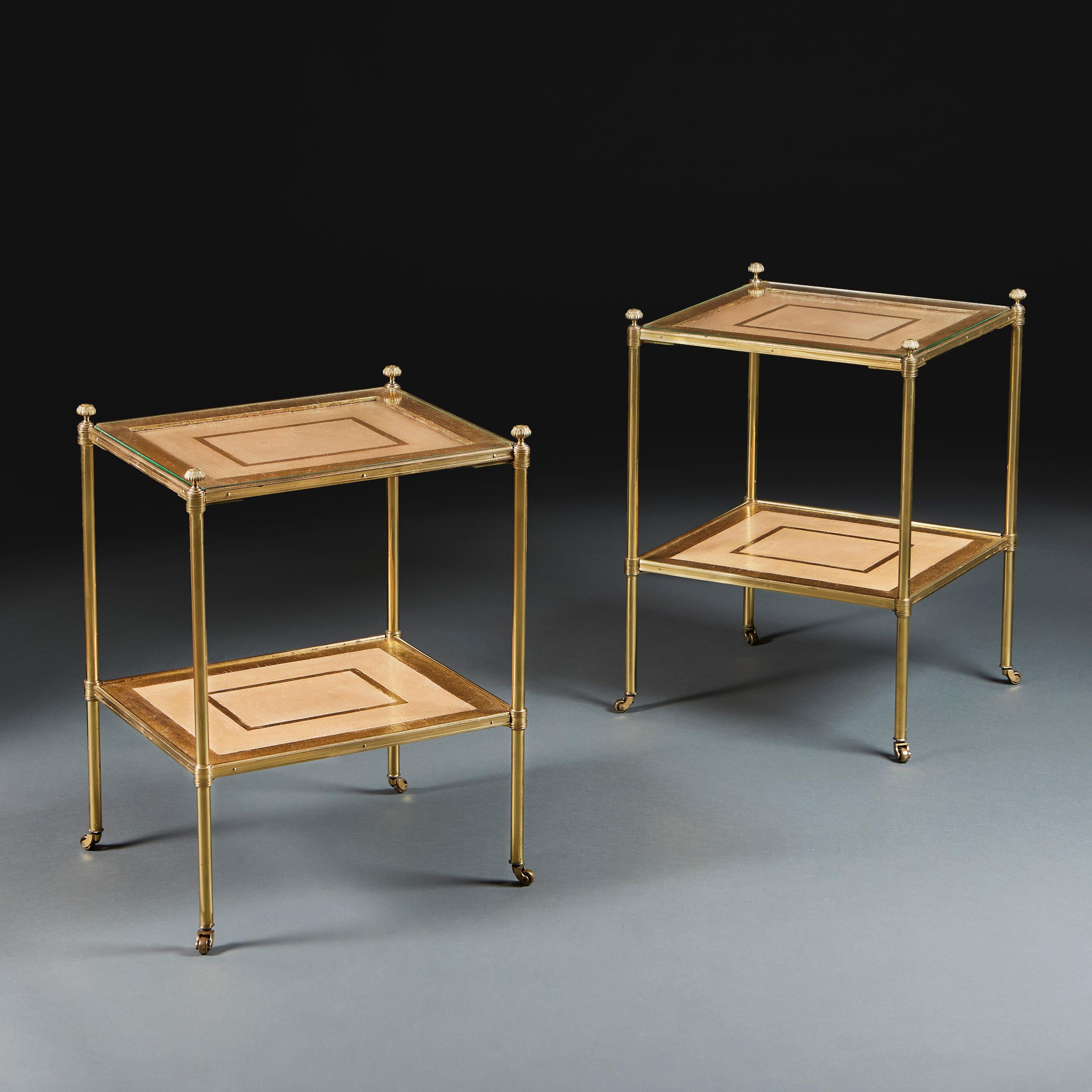 England, circa 1920
A pair of early twentieth century two tier brass etageres, probably by Mallett & Son, with craquelure surfaces in cream and gilt, the uprights surmounted by chased acanthhus leaf finials and terminating in brass castors.
Height