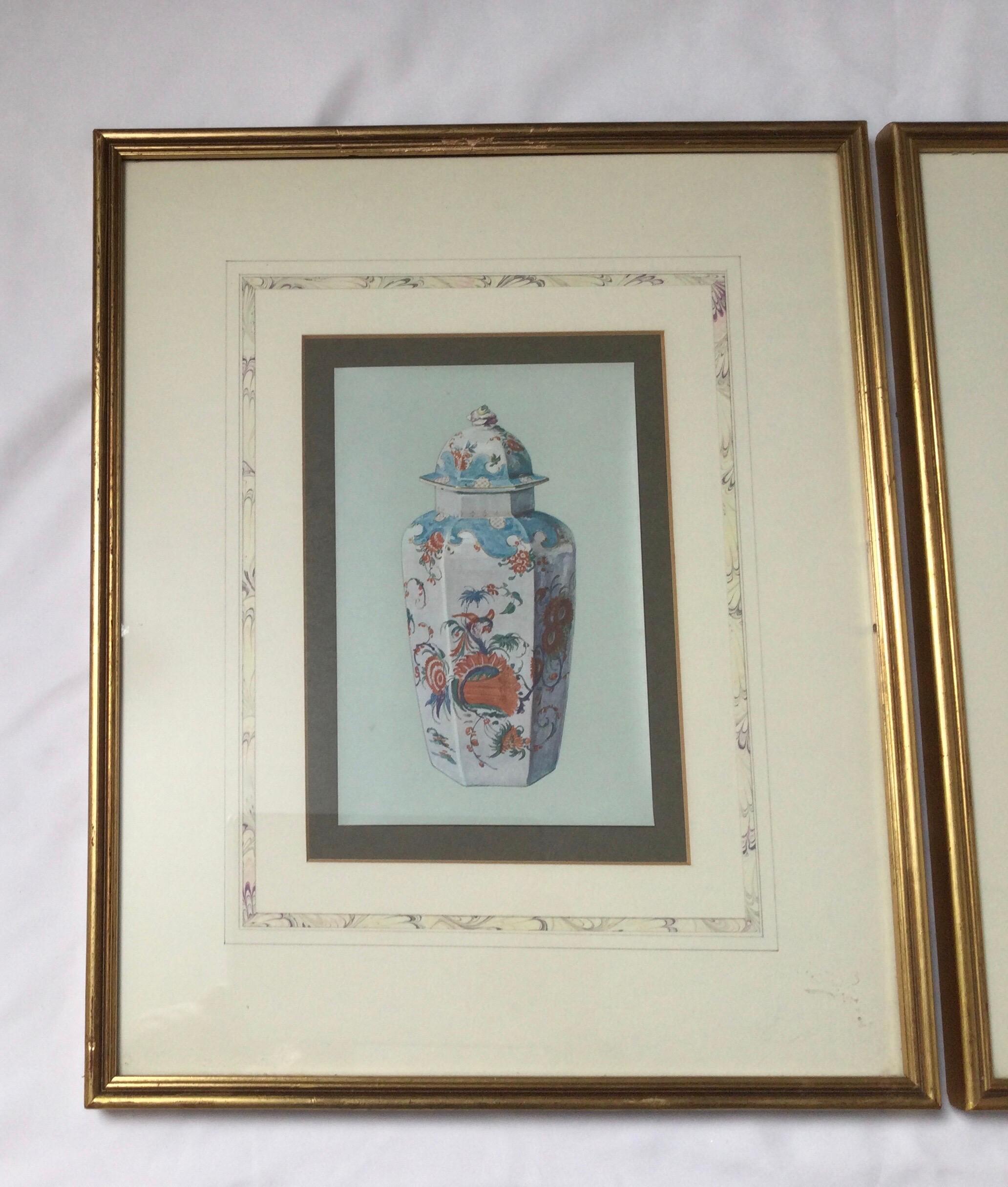 A pair of 1910 framed prints of Asian porcelain in giltwood frames. Beautifully matted in French matts.