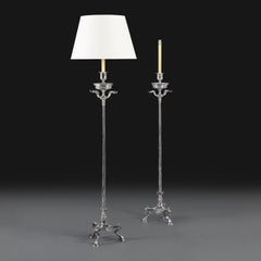 A Pair of Early 20th Century Greek Revival Silver Standard Lamps