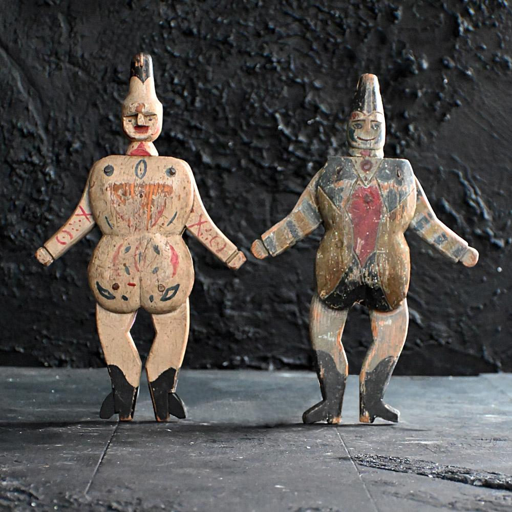 A pair of early 20th Century hand carved Jumping Jack toy figures 

A pair of early 20th Century hand carved / painted American Jumping Jack toy figures. With their original features and movement (String) in place and working, Once the string is
