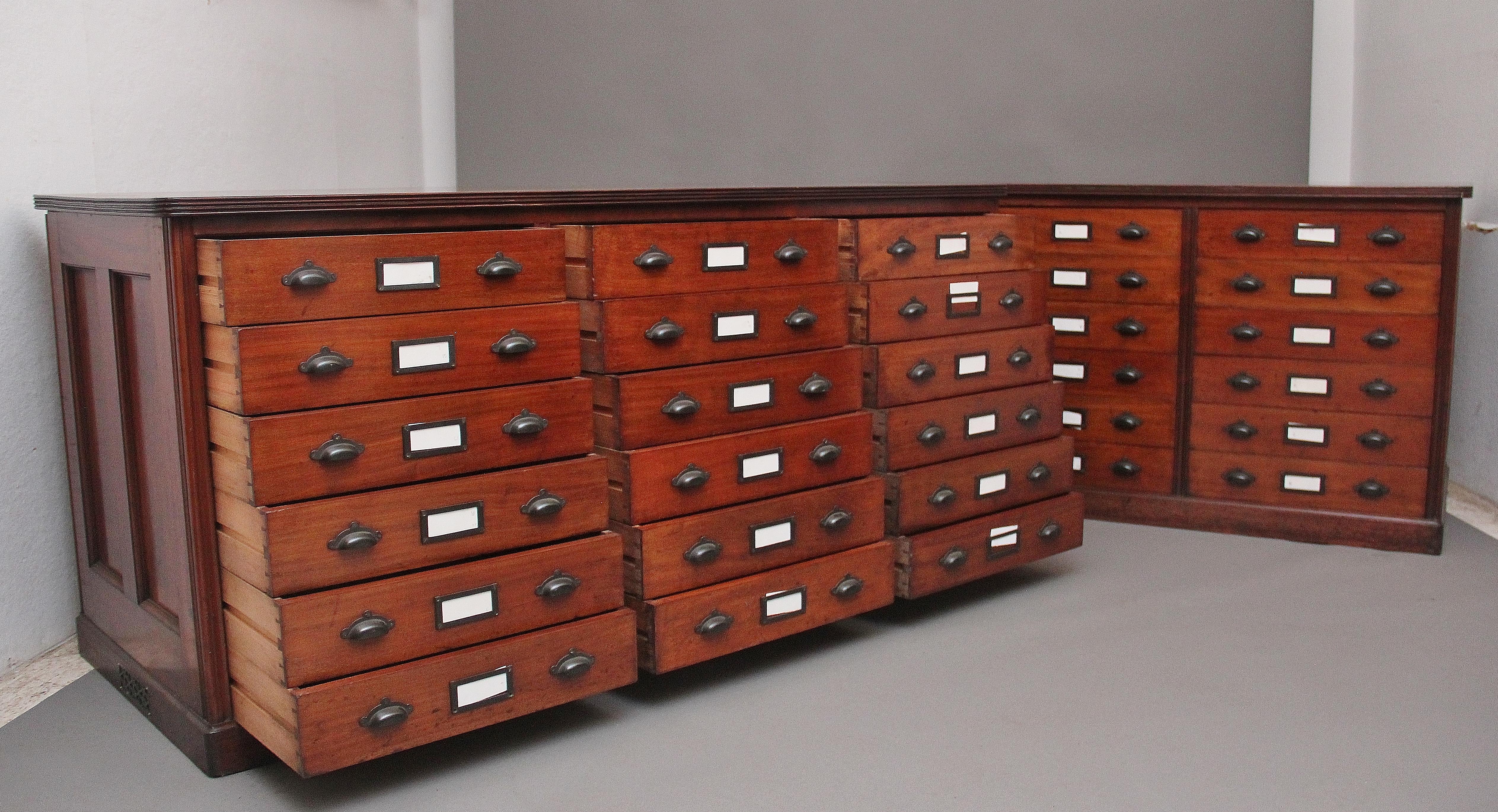 A pair of superb quality early 20th Century mahogany multi drawer chest’s that were originally made for the British museum, each chest having a combination of eighteen drawers with the original brass plate handles and name plates, lovely figured