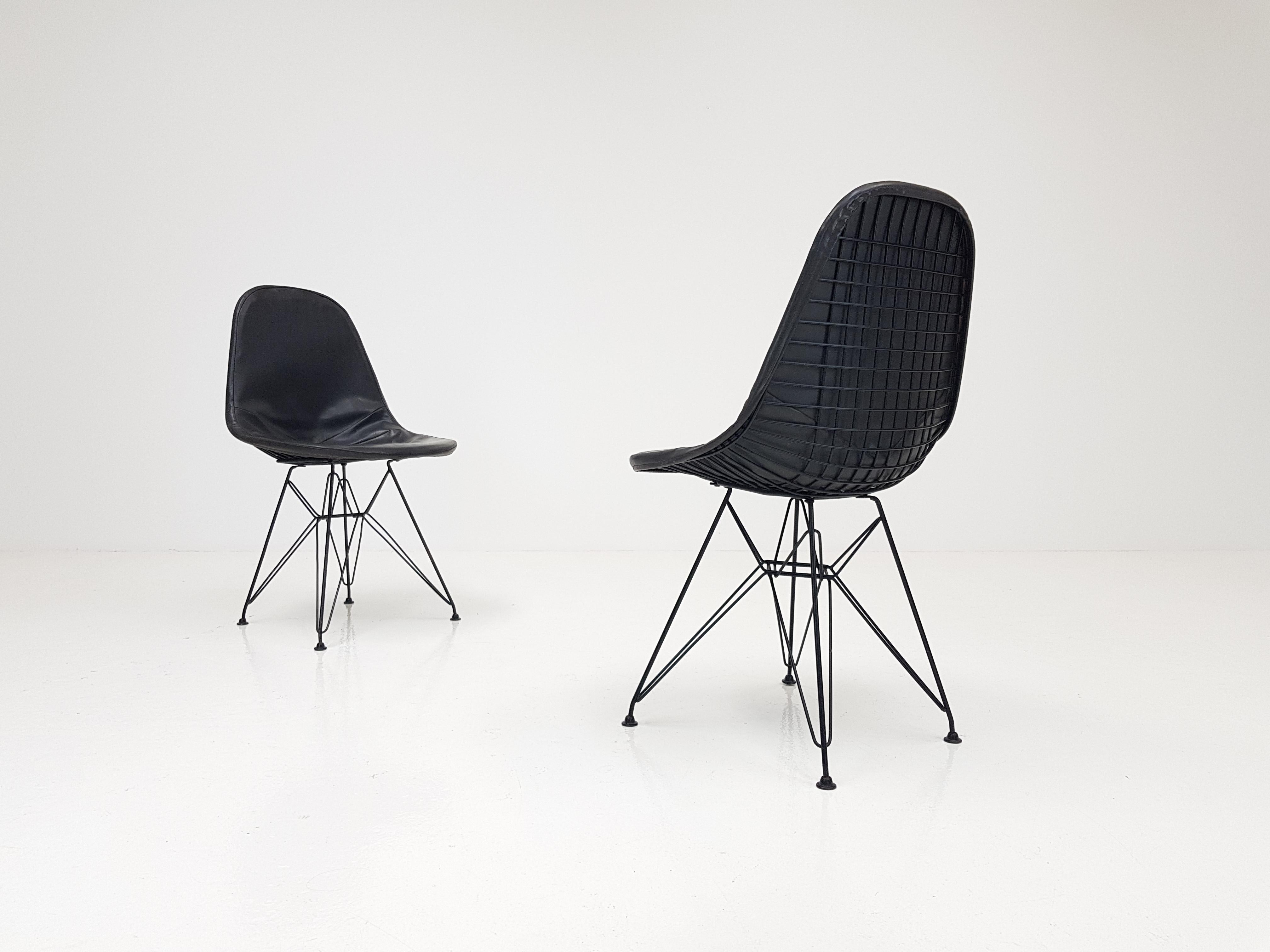 A pair of early Charles & Ray Eames DKR chairs with original vinyl cover, circa 1950s.

Featuring 'Eiffel' bases.

 





.