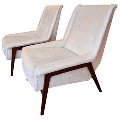 A pair of early edition Poltrona armchairs