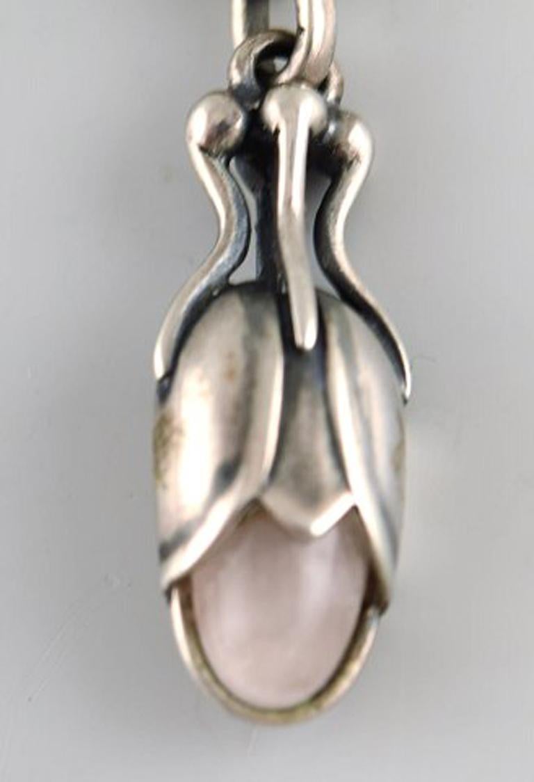 A pair of earrings in sterling silver by Georg Jensen adorned with rose quartz. 
Stamped. Dated 2011.
In very good condition. 
Measures: 3.5 cm x 1 cm.