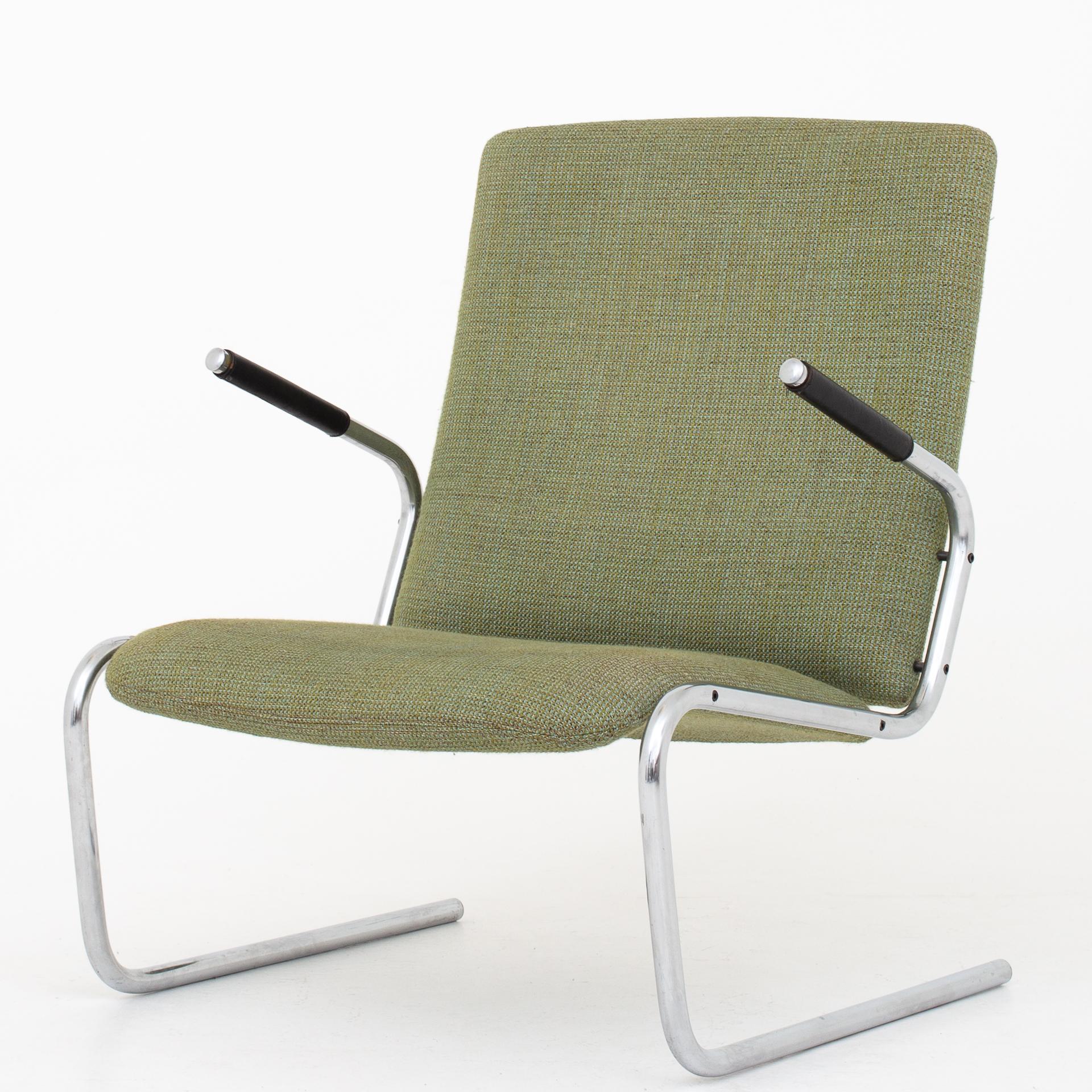 Easy chairs with a cantilever frame in chromed steel, upholstered in green wool with black leather armrests. Maker Kusch & Co.