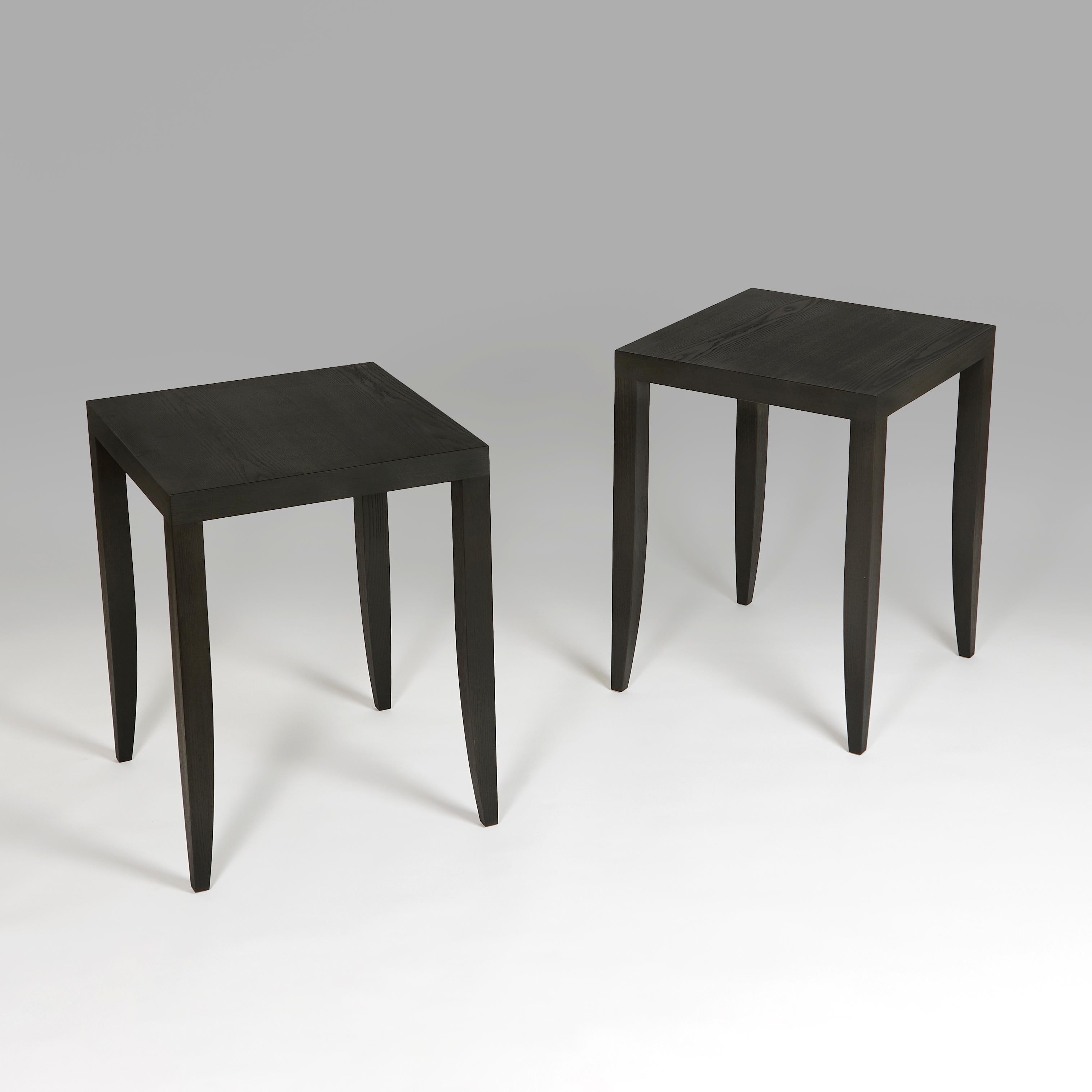 +VAT

England, made to order.

A pair of square occasional tables with tapering legs, made in solid ash with a matte ebonised finish. 

Lead time: 6 - 8 weeks.

Height   61.00cm
Width    47.00cm
Depth    47.00cm        