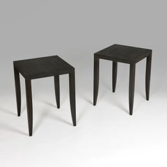 A pair of ebonised ash occasional tables