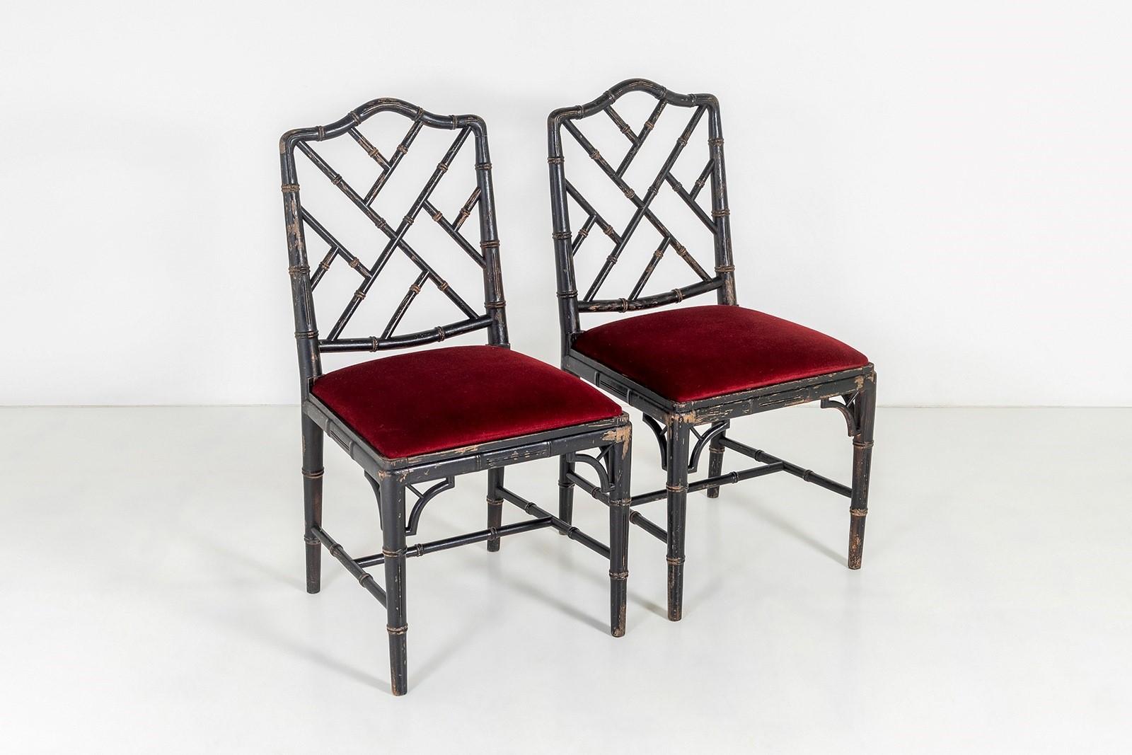 A charming pair of faux bamboo Chinese Chippendale style chairs in a distressed ebonised finish with deep red velvet fabric seat.
A pair of chairs of good character, these vintage examples have a great decorative charm with worn patina. Great