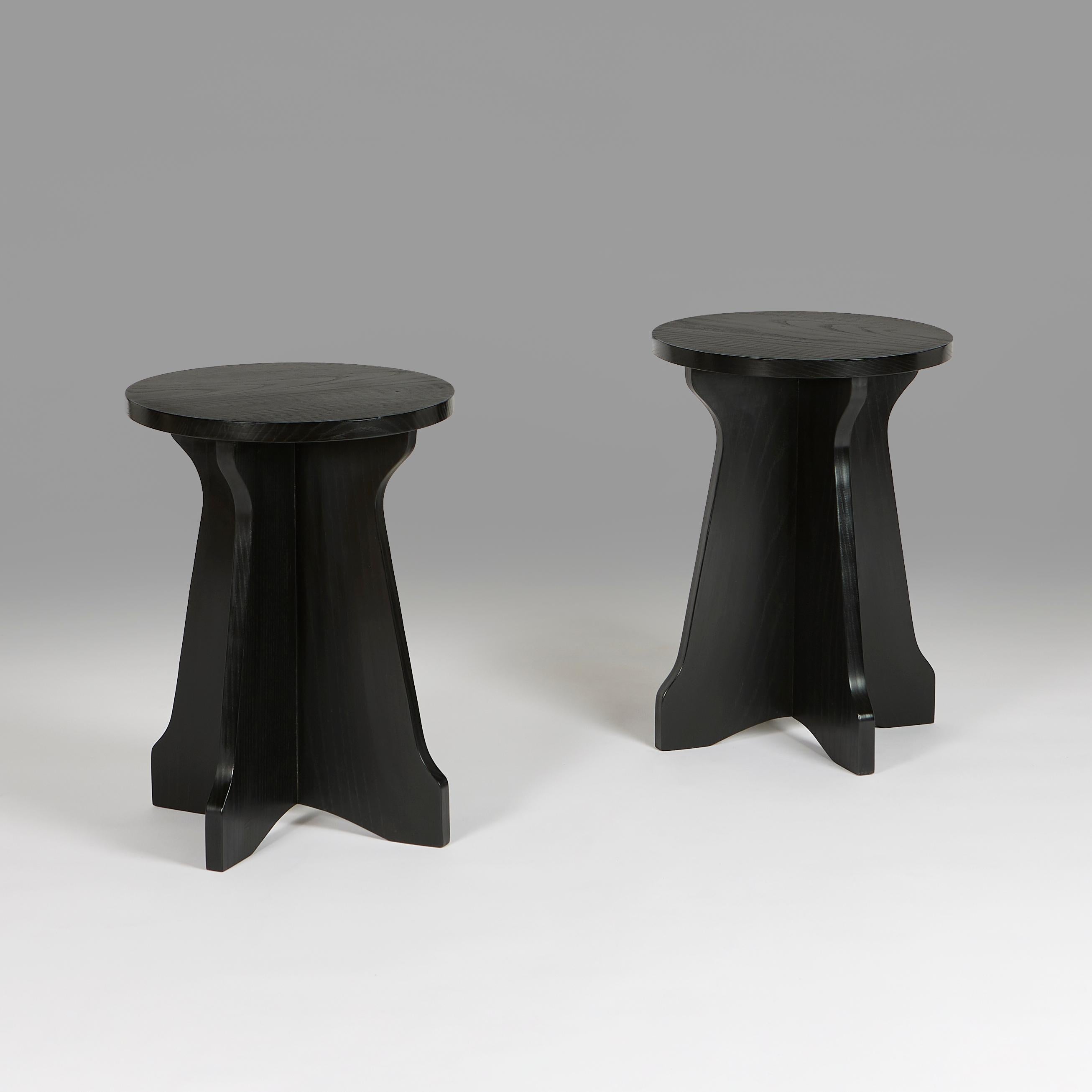 +VAT

England, made to order.

A pair of ebonised ash modernist occasional tables, with circular tops and cross frame bases. Made in the UK from sustainable ash, with black lacquer stain finish. 

Lead time 6-8 weeks.

Height 45.00cm
Diameter 33.50cm