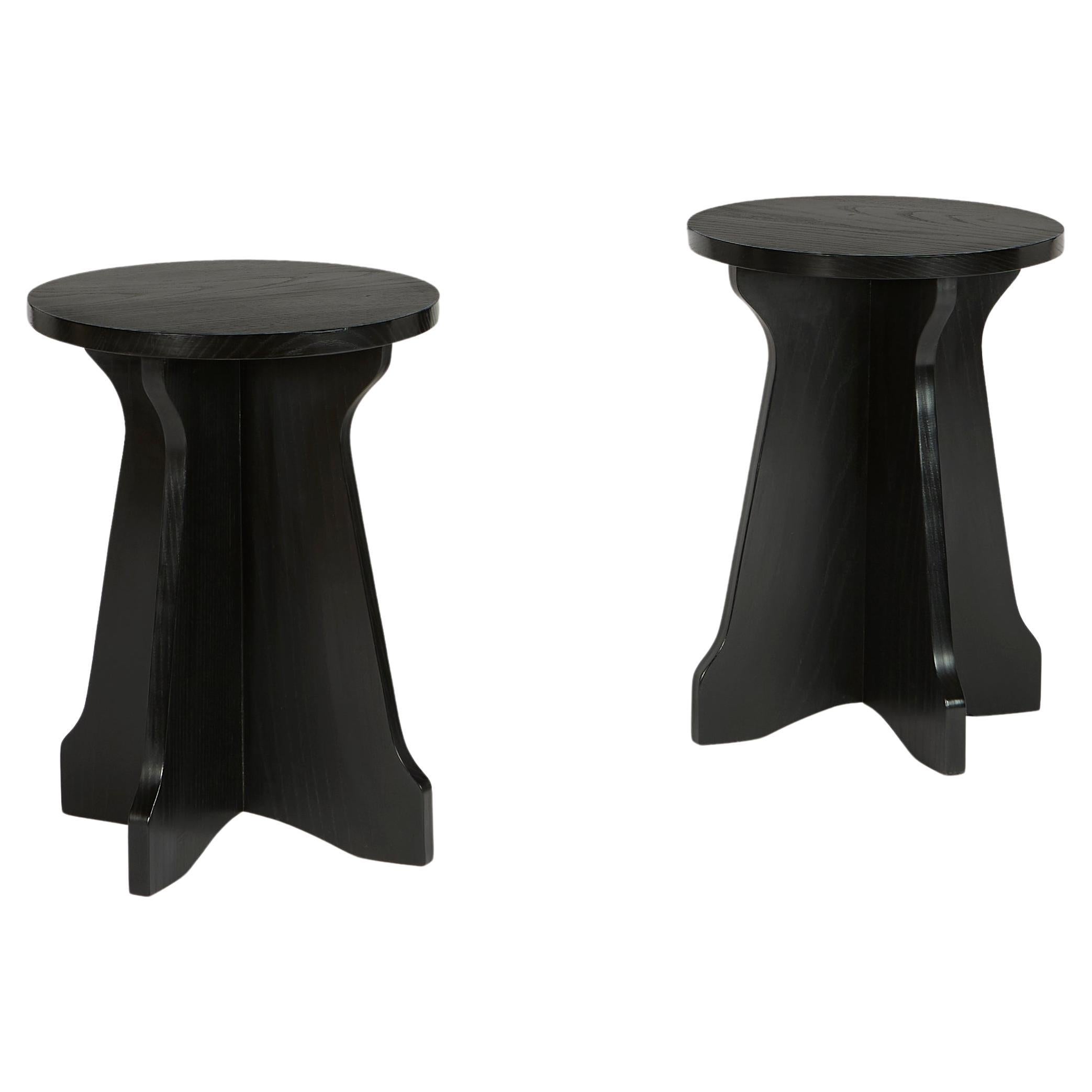 A pair of ebonised Modernist occasional tables  For Sale