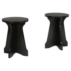 A pair of ebonised Modernist occasional tables 