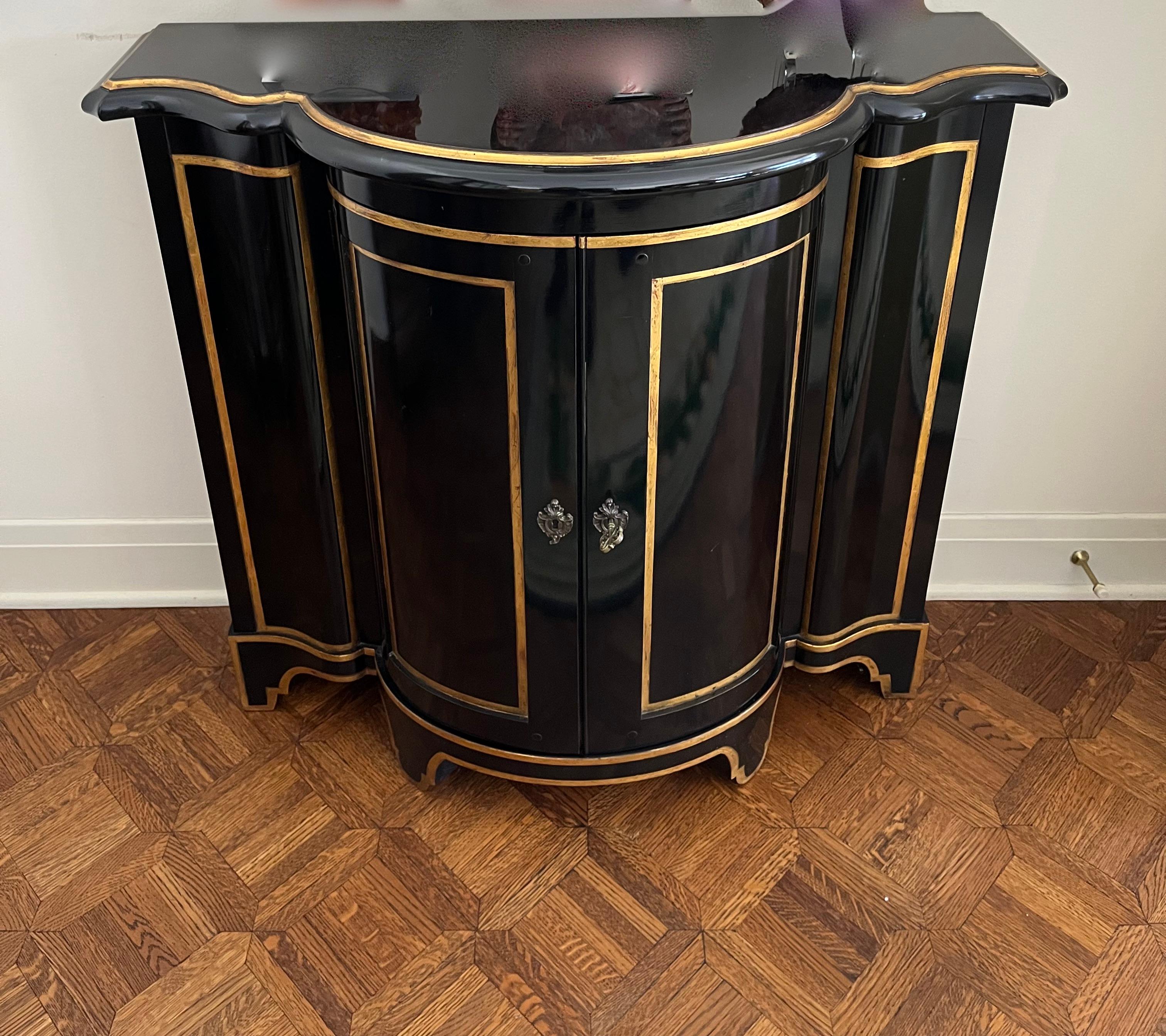 Wood Pair of Ebonized and Gilt Demi-Lune Cabinets by Baker Furniture Co