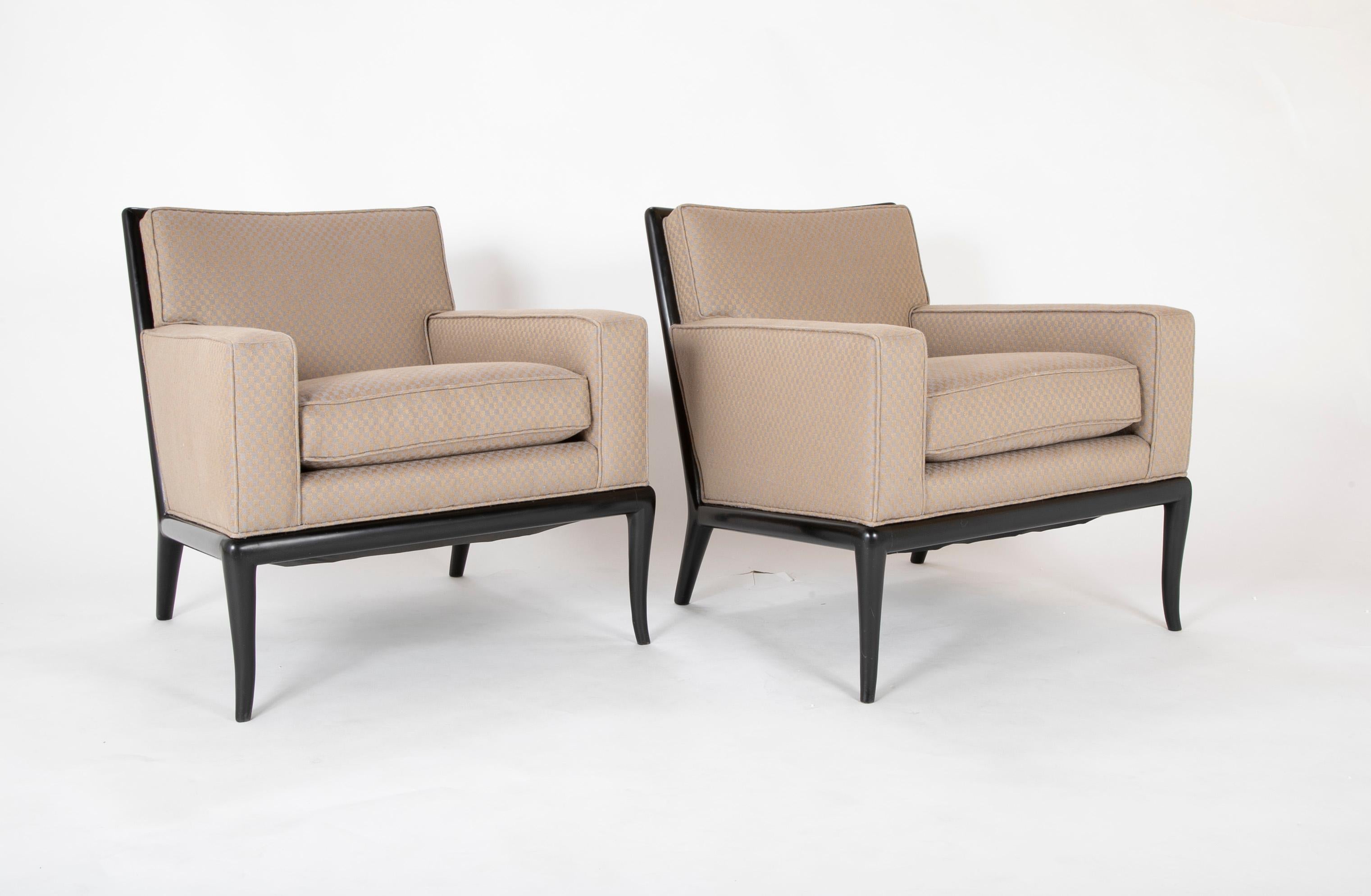 A pair of armchairs newly upholstered in Rogers and Goffigon fabric. Having ebonized frames, designed by T.H. Robsjohn Gibbings. Newly reupholstered in Rogers and Goffigon fabric.