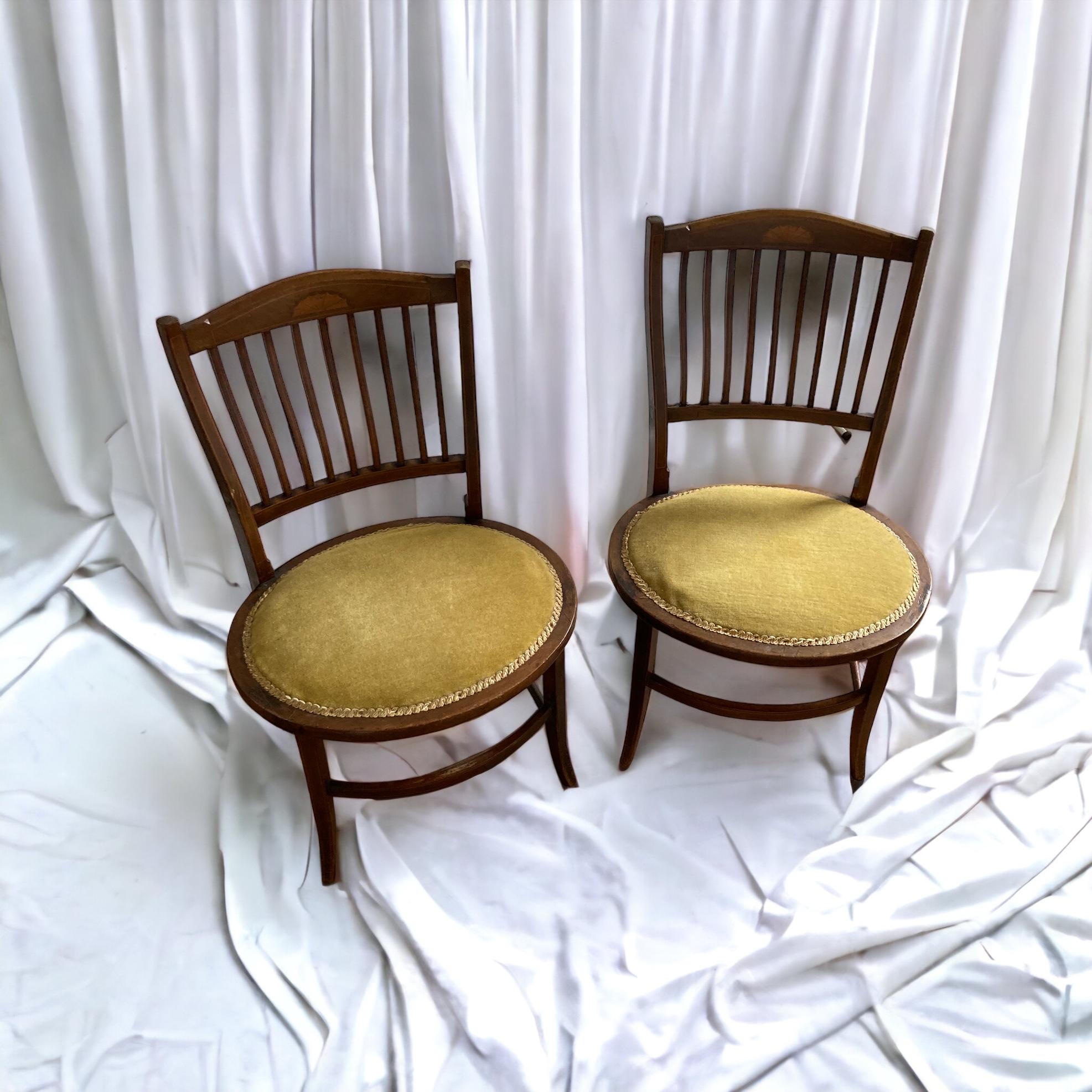 A pair of Edwardian Antique Mahogany Oval based hall, side chairs. Original Olive green upholstery.

Good condition

H: 76 cm

W: 52 cm

Seat H: 37 cm

D: 44 cm
