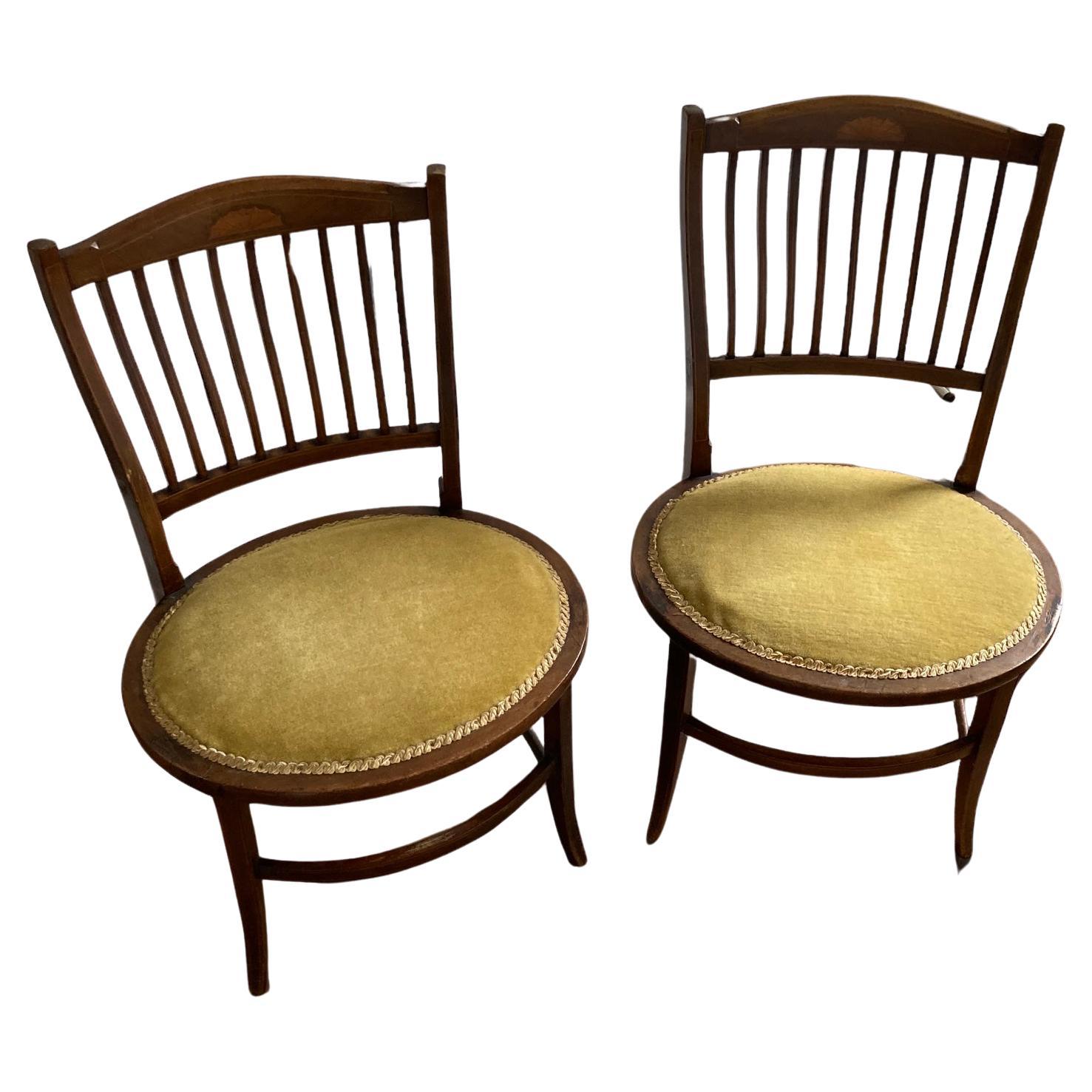 A pair of Edwardian Antique Mahogany Oval based hall chairs For Sale