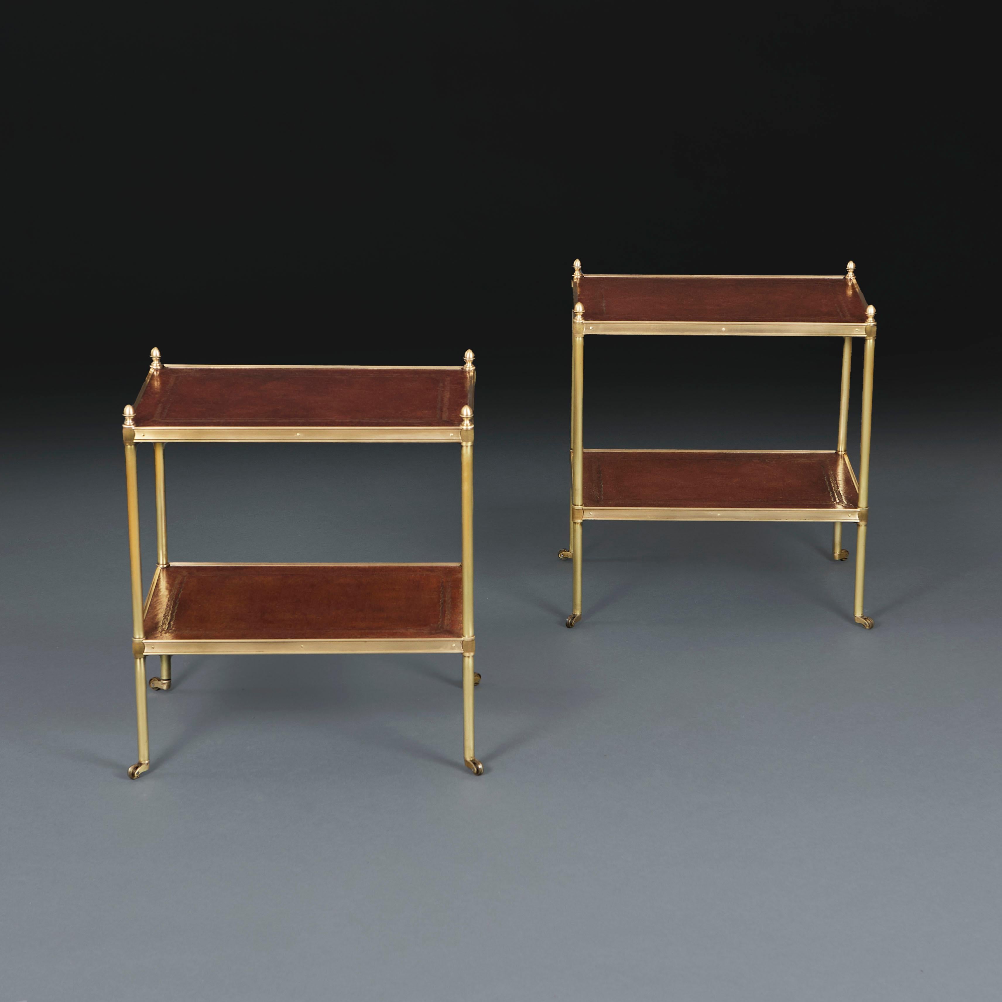 English A Pair of Edwardian Leather and Brass Etageres