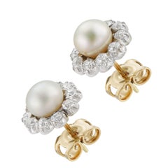 A pair of Edwardian natural pearl and diamond earrings