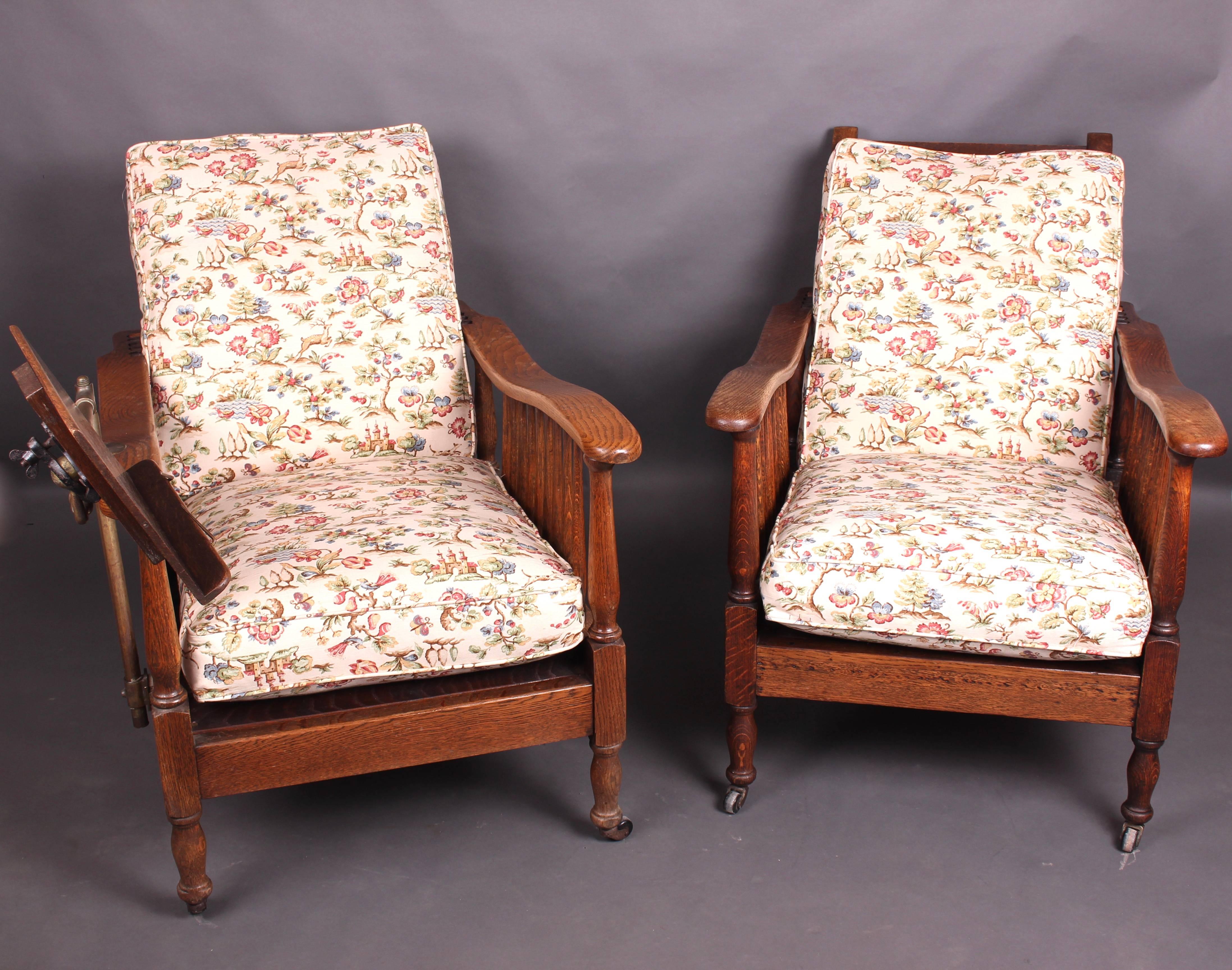 A lovely pair of Edwardian oak steamer chairs. One with a carters patent reading stand. Beautifully designed and well made. Having wonderful classic lines with a slatted back and base, the back being adjustable depending on your mood! The arms are