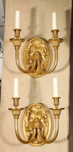 A Pair of E.F. Caldwell Neoclassical Gilt Bronze Two-Arm Wall Sconces