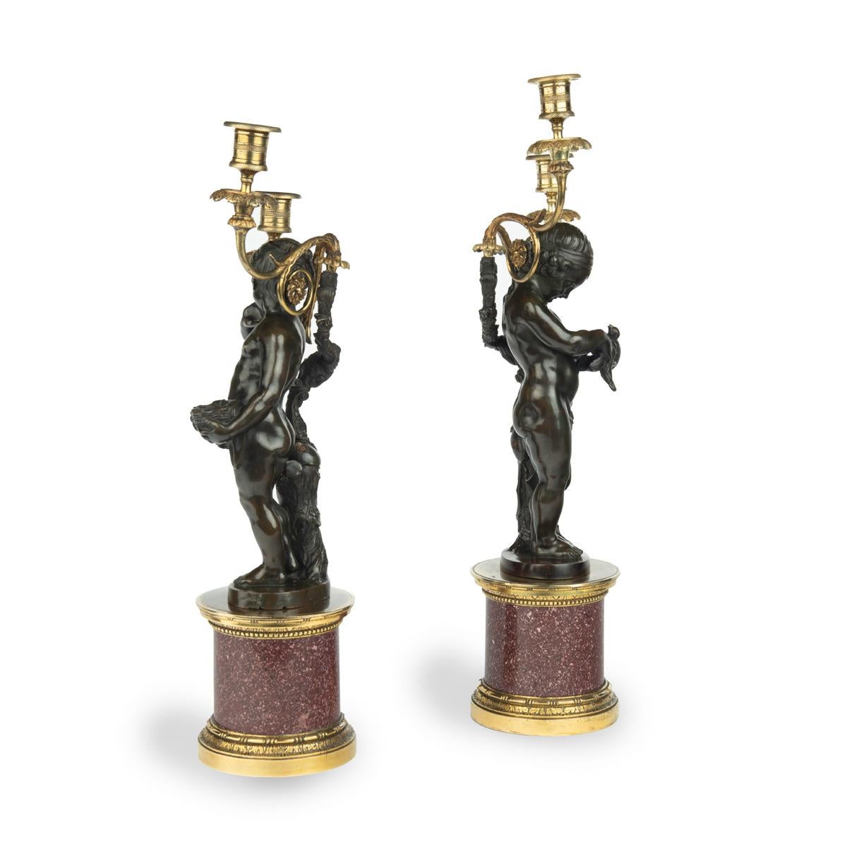 A pair of Egyptian porphyry and bronze candelabra after Charles-Antoine Bridan In Good Condition For Sale In Lymington, Hampshire
