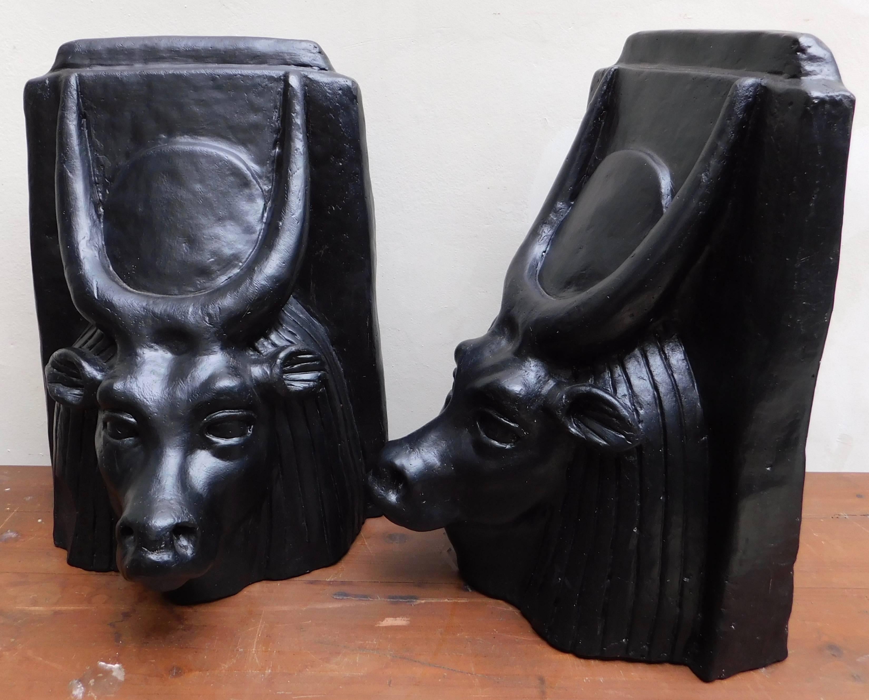 A pair of cast plaster sculptures of the bulls head of the Egyptian god Apis (Apis is the son of Hathor and served as an intermediary between humans and other powerful deities) the statues are from an old theatre and were part of a door decoration.