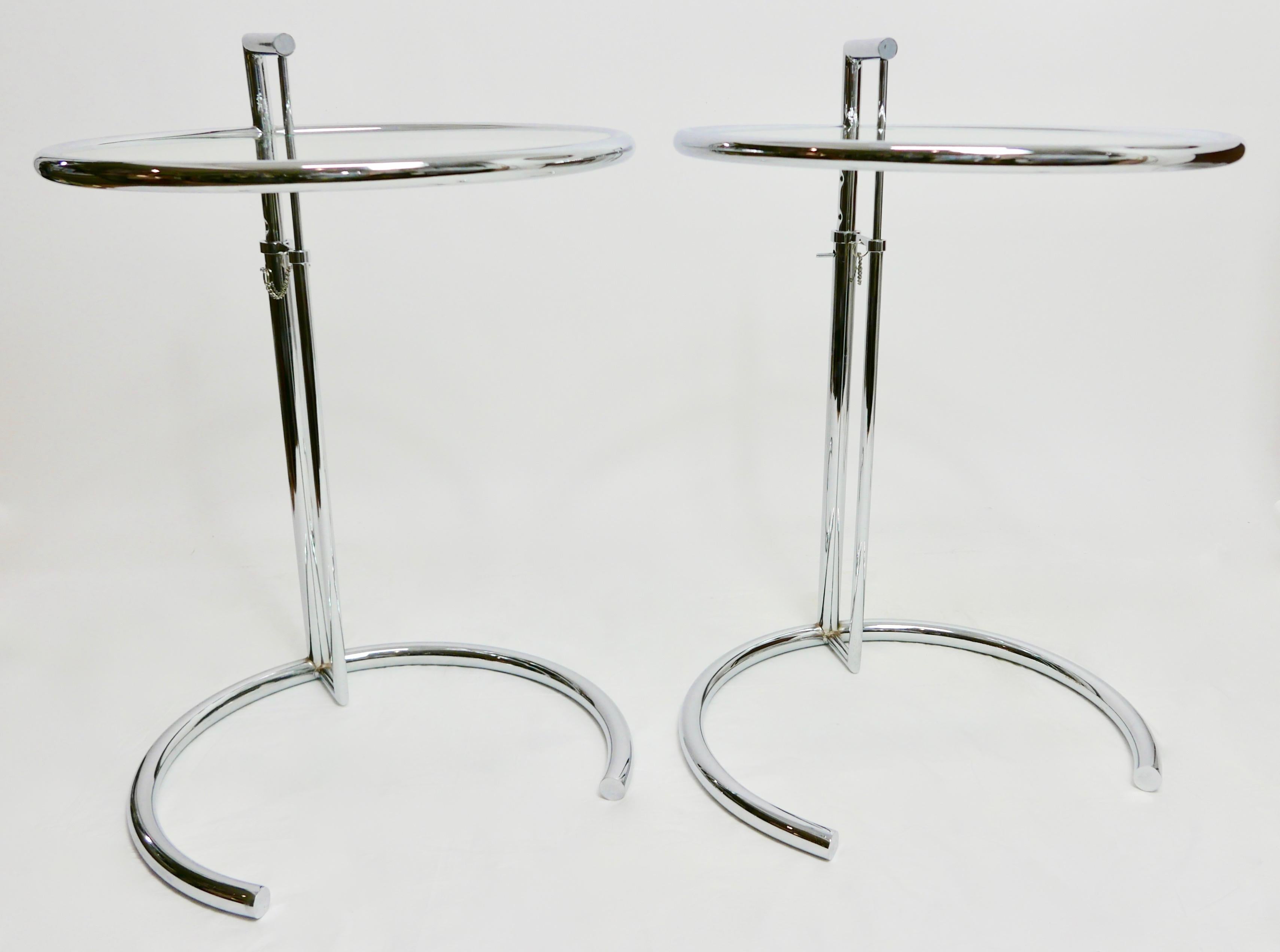 Vintage pair of Mid-Century Modern adjustable chrome metal and glass side or occasional tables in the style of Eileen Gray Model E1027
Eileen Gray was a French-based architect and furniture designer and a pioneer of the modern movement in