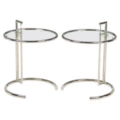 A Pair of Eileen Gray Polished Chrome and Glass Tables