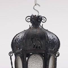 A pair of elaborate Italian wrought iron hanging lanterns C 1920.