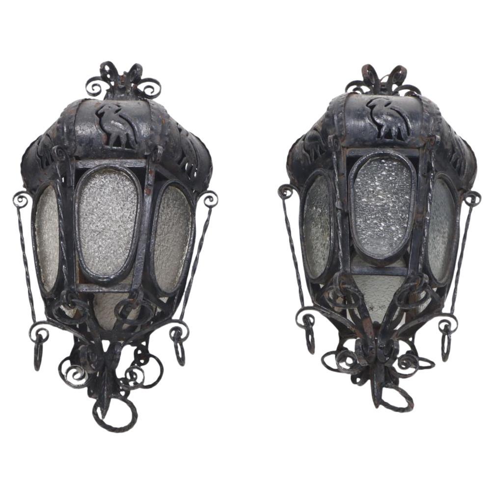 A pair of elaborate Italian wrought iron hanging lanterns C 1920. For Sale