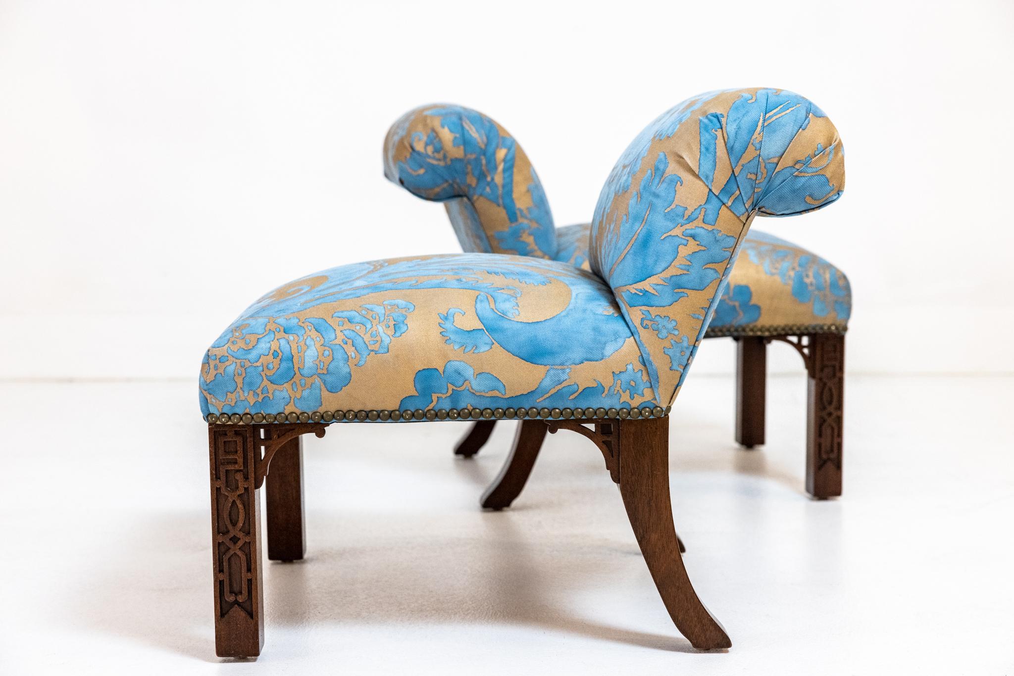 This pair of Elbow chairs in the Chinese Chippendale style were designed by William Haines and used quite often in his bespoke interiors. This pair are from the Estate of Keith McCoy a long standing arbiter of good taste in LA design community. This