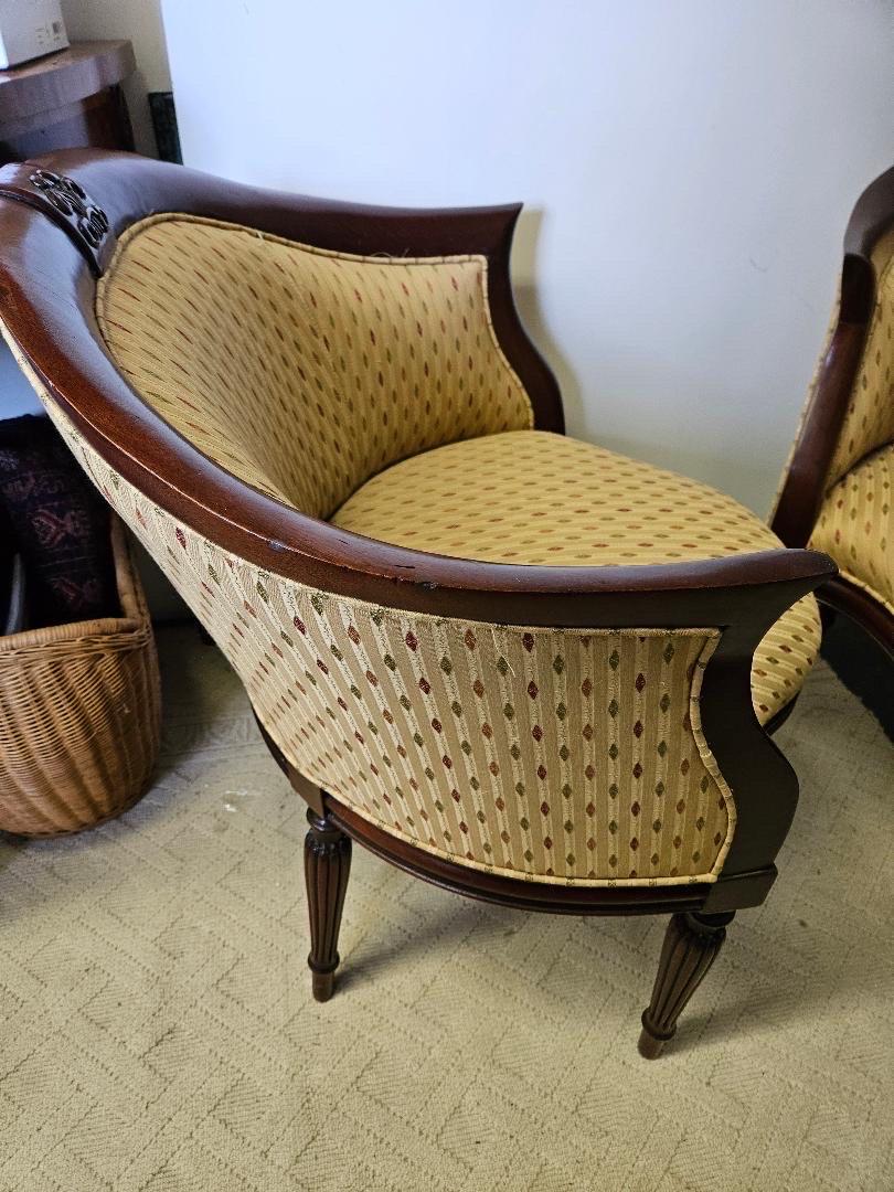 Elegant Pair of 1980s Armchairs, unusual shape with Fluted legs and satinwood Inlaid blocks atop each leg. Beautiful high end mahogany frames with Original Upholstery in excellent condition. Made by a top lever maker,  Southwood Furniture Company,