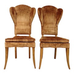 A Pair of Elegant High Back Wingback Chairs