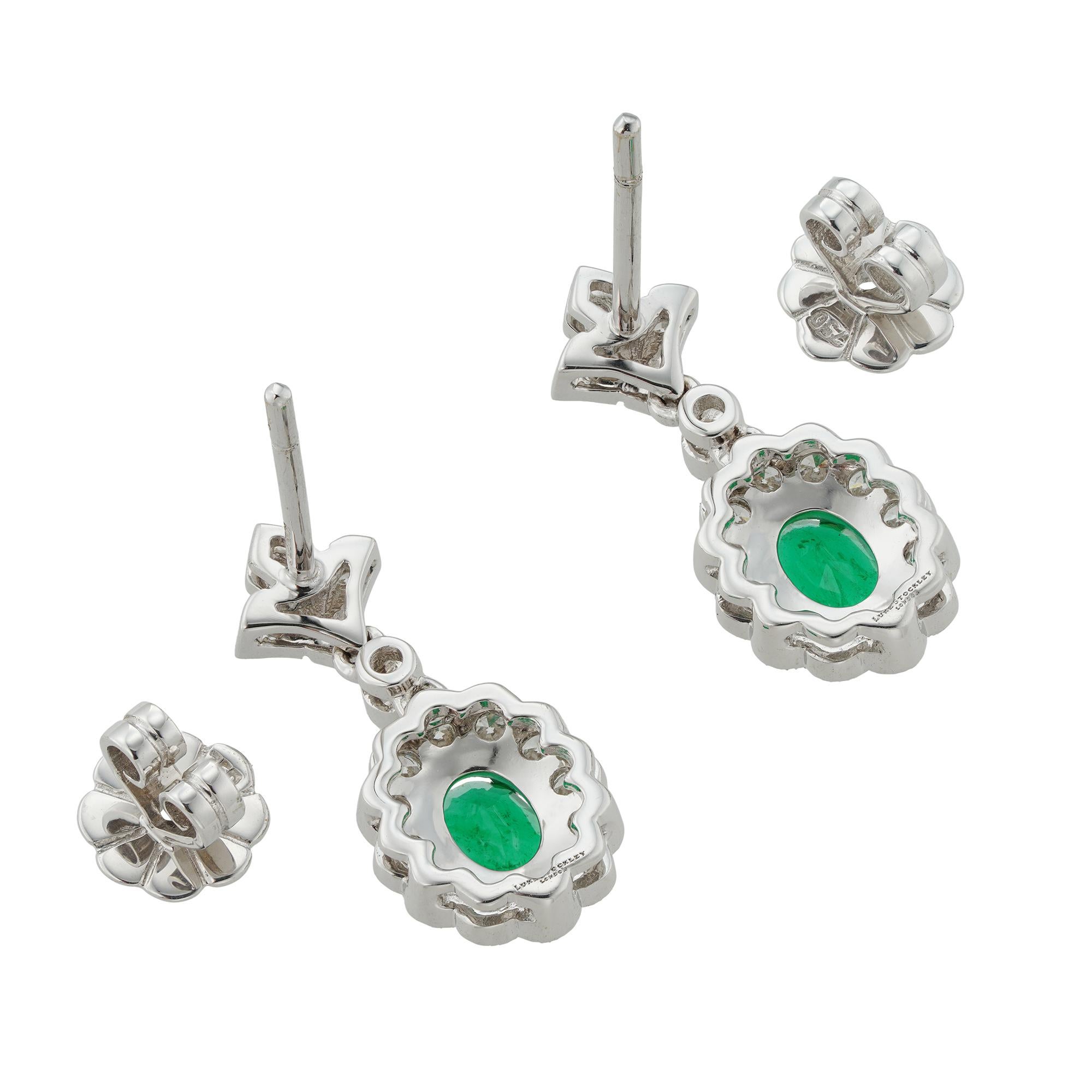 Emerald Cut Pair of Emerald and Diamond Drop Cluster Earrings For Sale