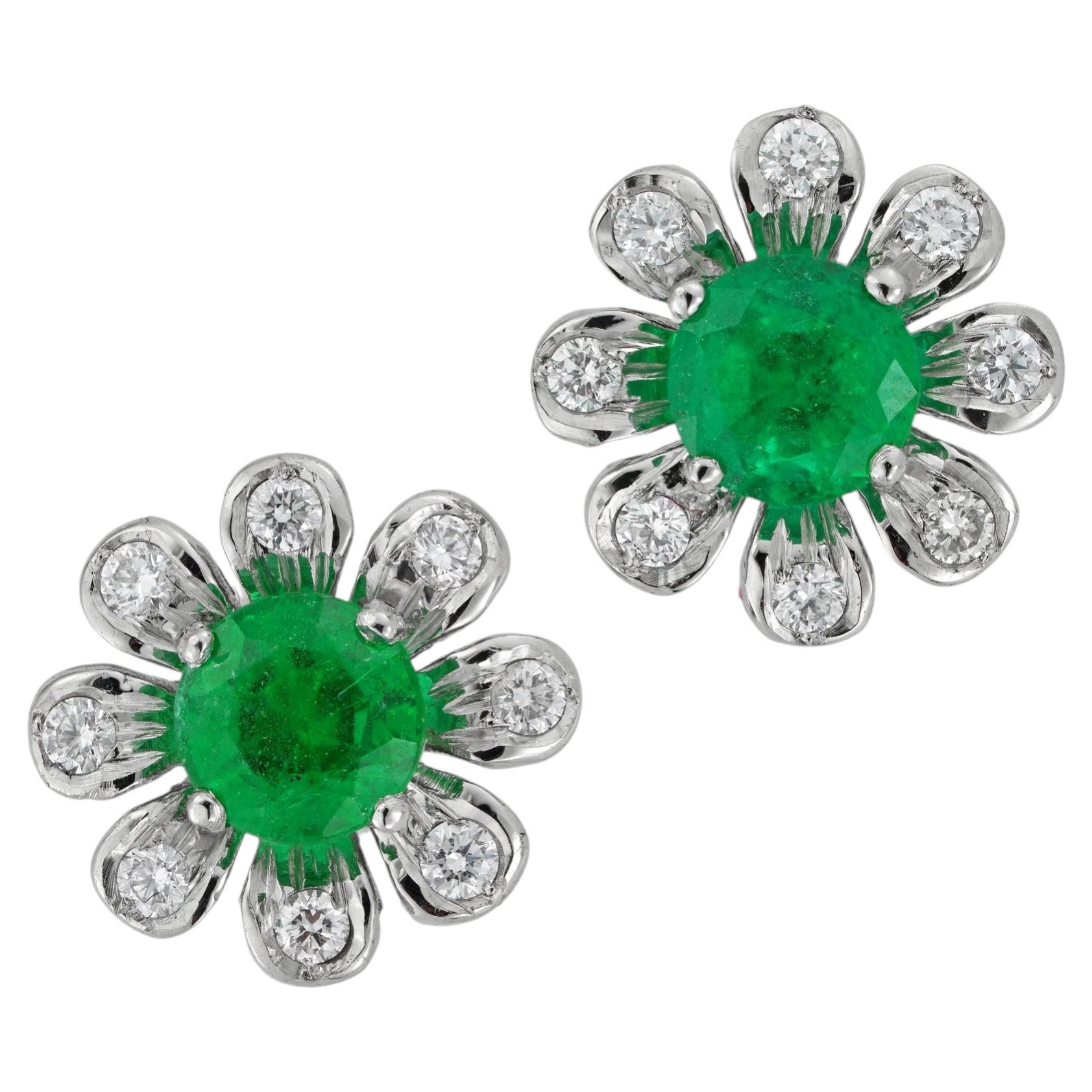A pair of emerald and diamond flower cluster earrings For Sale