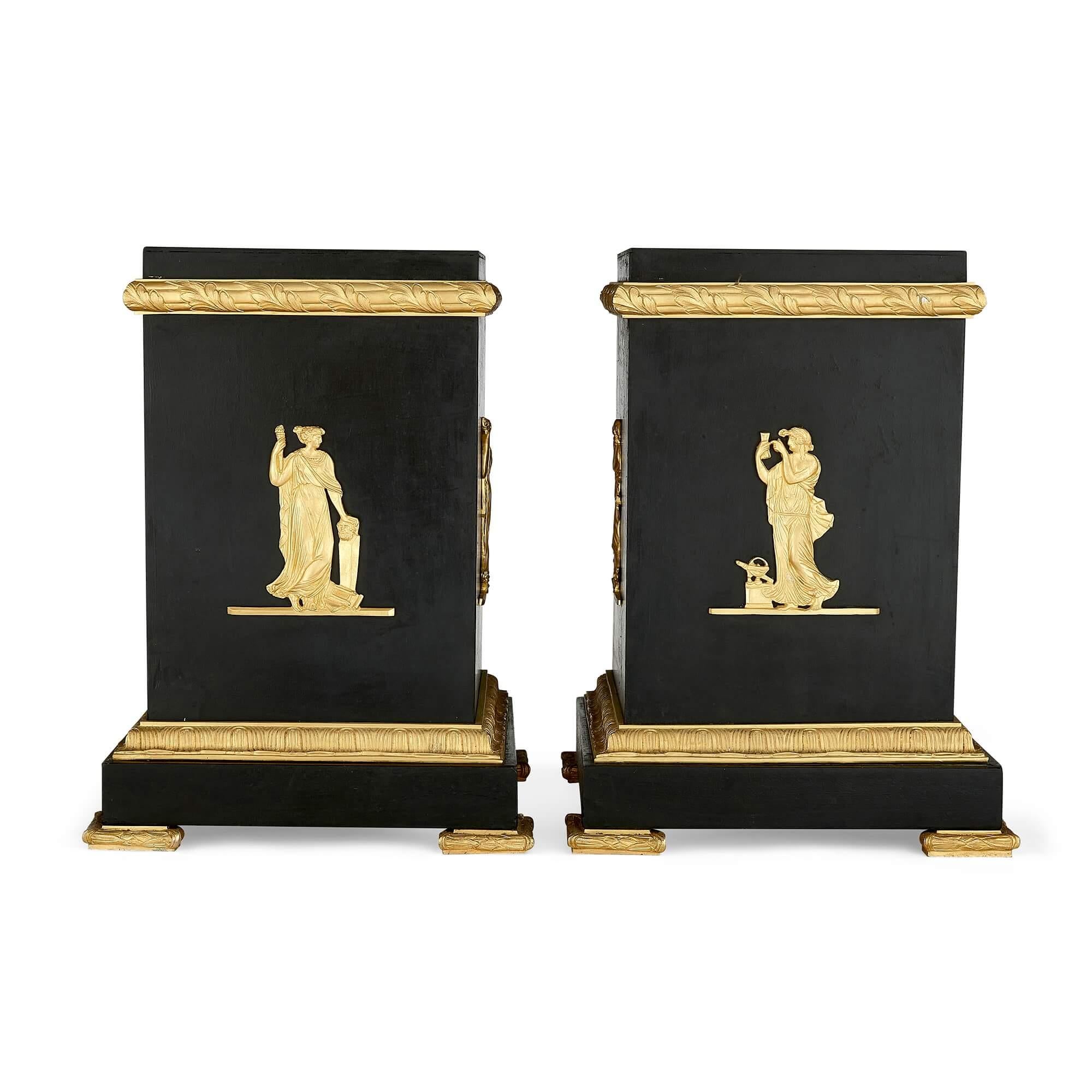 A pair of Empire-style Neoclassical gilt and patinated bronze stands
French, 20th Century
42cm high x 31cm wide x 31 cm depth

Made from patinated bronze and gilt bronze in the French Empire style, with Neoclassical influences, these excellent