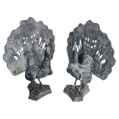 A pair of English 19th century peacock garden sculptures made of lead.