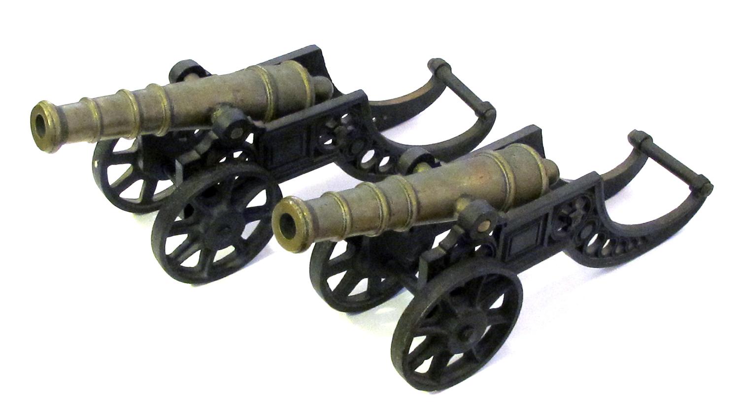 Early 20th Century Pair of English Brass Ornamental Signal Cannons on Cast Iron Carriages