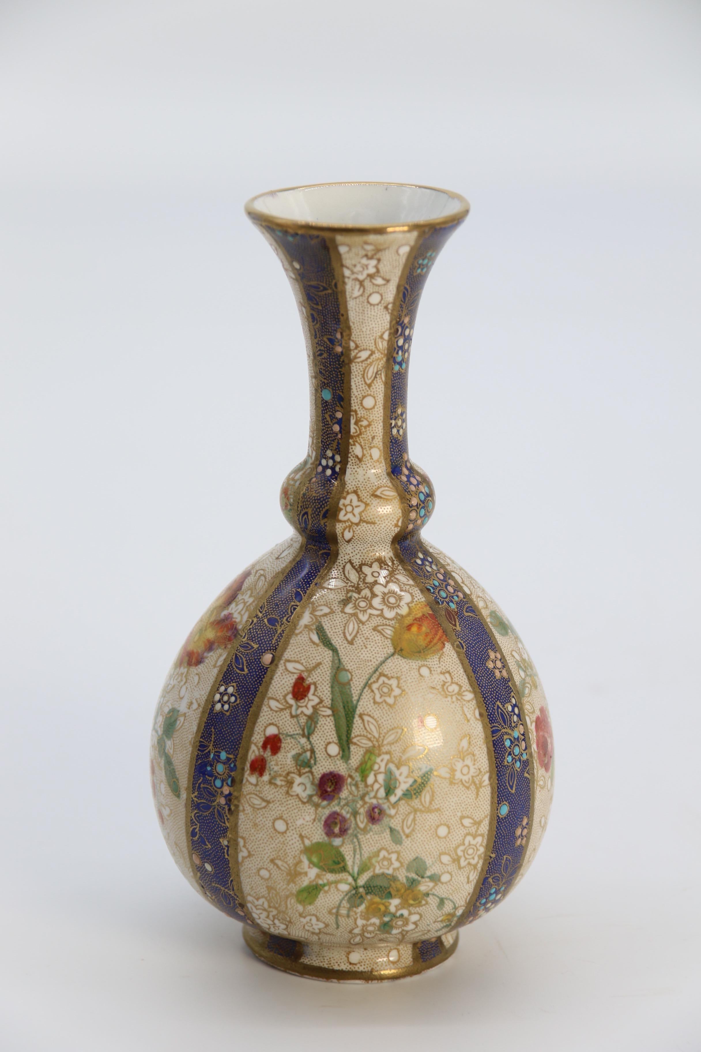 A pair of English early Carlton Ware enamelled and gilt floral vases, circa 1900 12