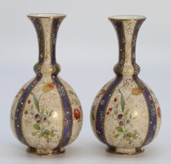 A pair of English early Carlton Ware enamelled and gilt floral vases, circa 1900