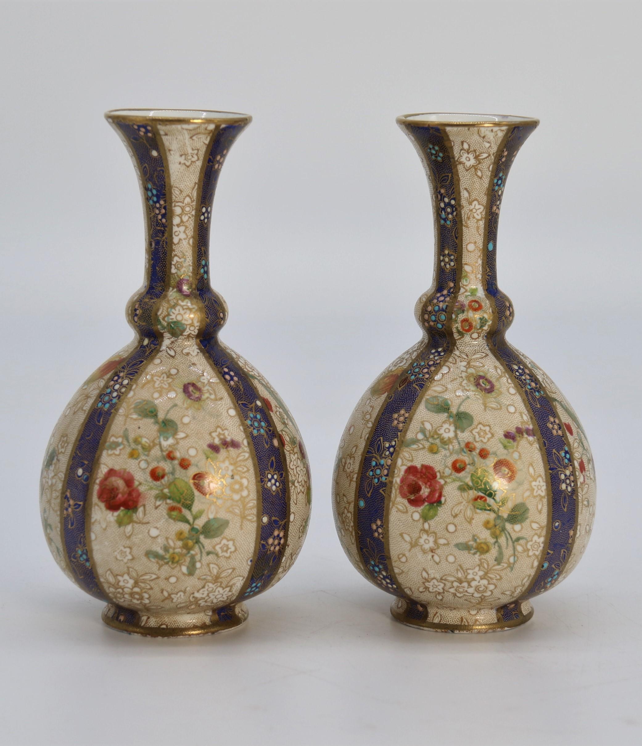 Other A pair of English early Carlton Ware enamelled and gilt floral vases, circa 1900