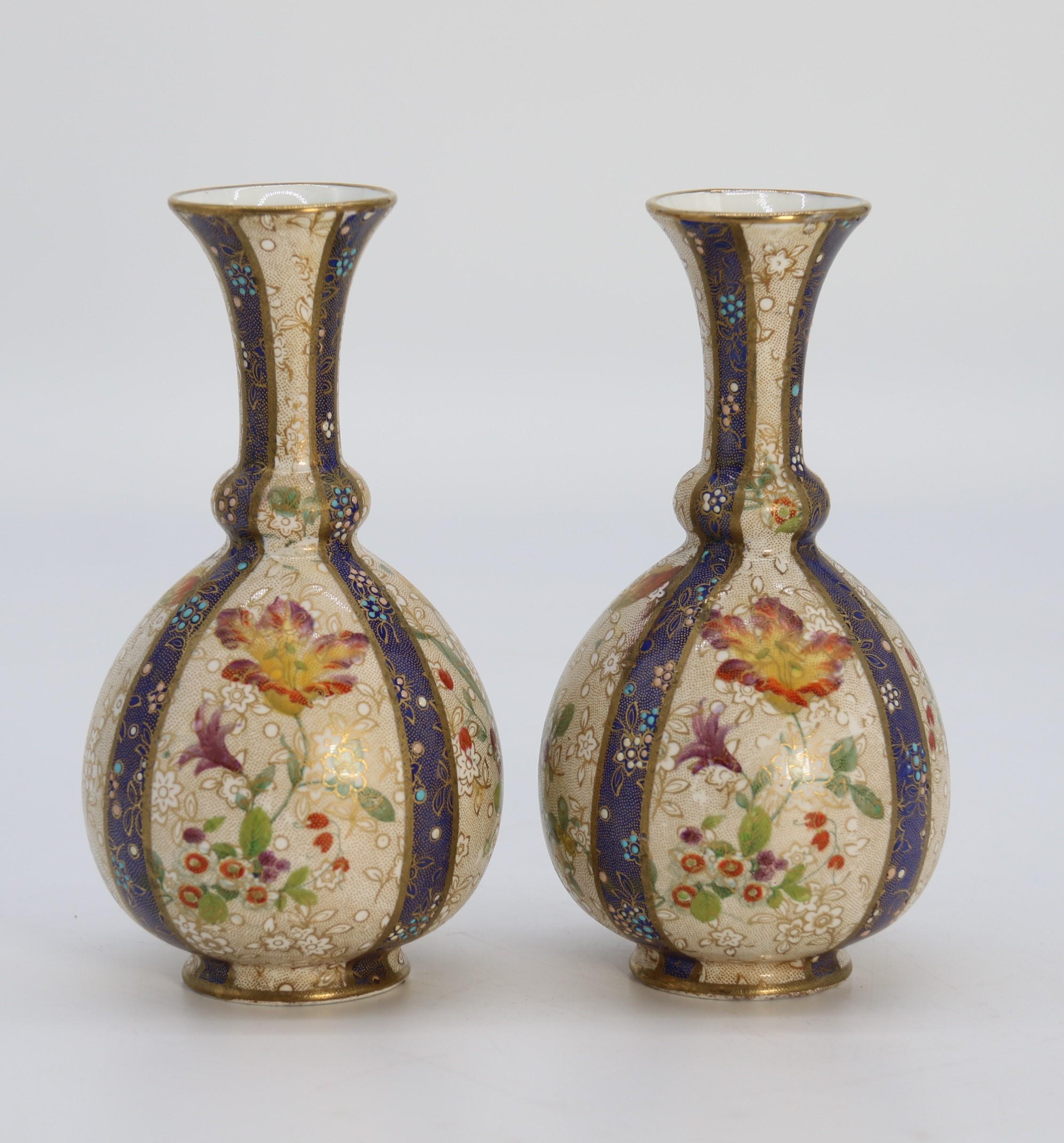 Enameled A pair of English early Carlton Ware enamelled and gilt floral vases, circa 1900